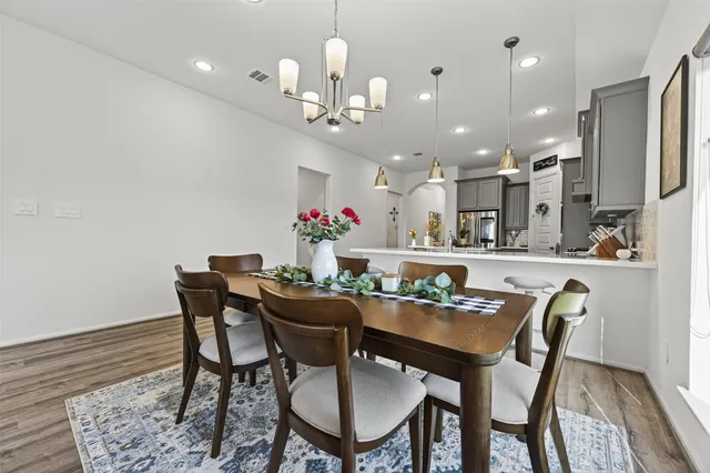 a living room with furniture gym equipment and a flat screen tv