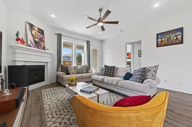 a view of a patio with couches chairs and a yard