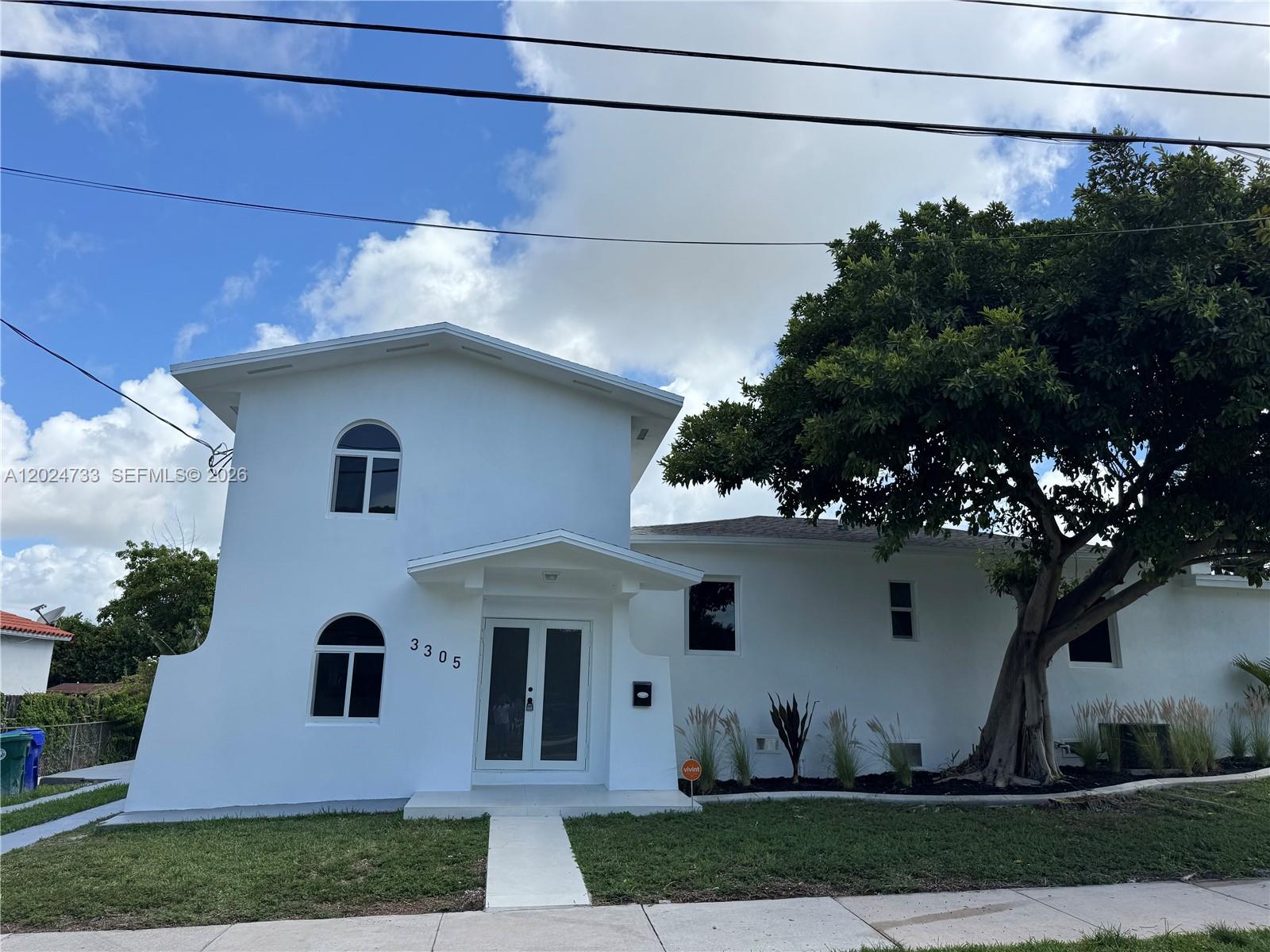3305 Southwest 28th Street, Unit 3305 Miami, FL 33133 - Photo 1 of 17 a house view with a garden
