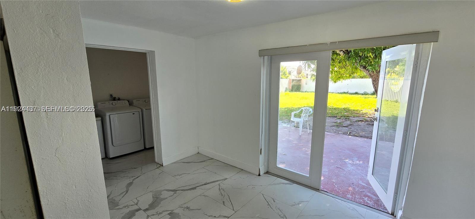 12140 Southwest 218th Street Miami, FL 33170 - Photo 6 of 11 an empty room with window