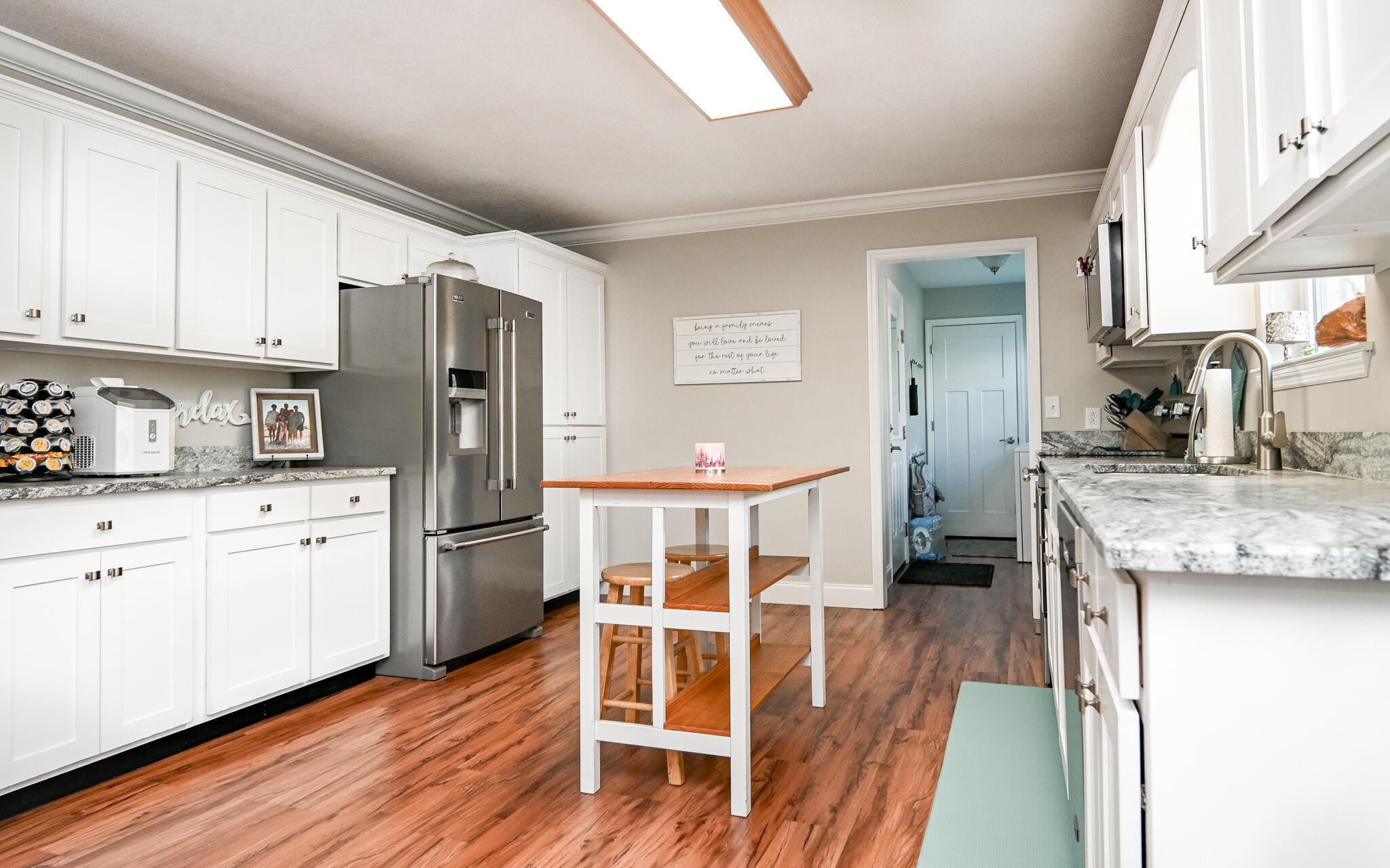 276 Mason Road McDonald, TN 37353 - Photo 19 of 67 a kitchen with stainless steel appliances granite countertop a refrigerator a sink dishwasher a oven with white cabinets and wooden floor