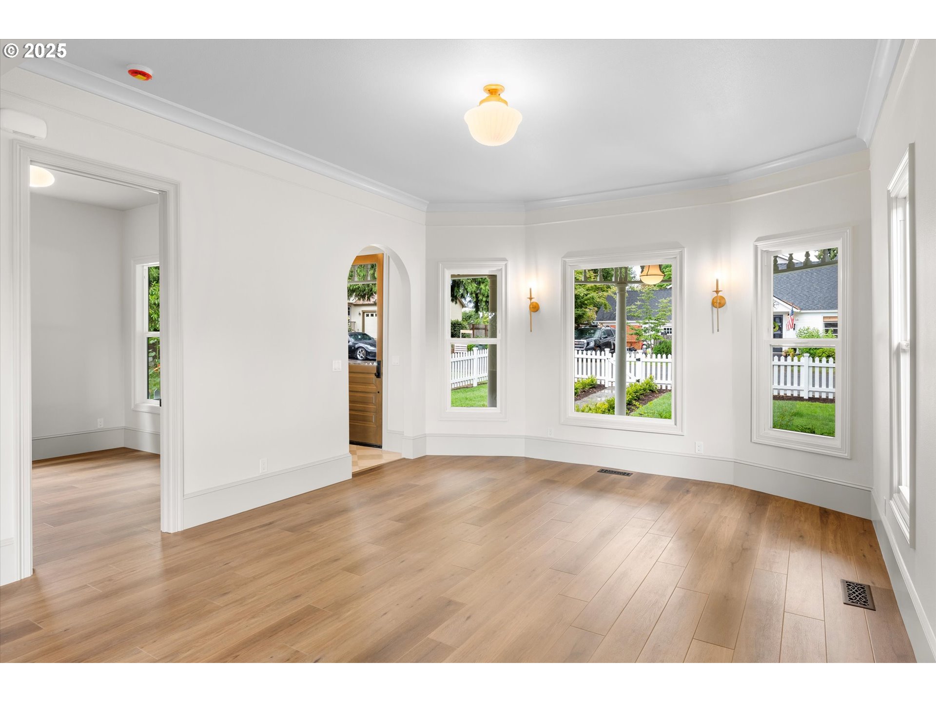 2089 5th Avenue West Linn, OR 97068 - Photo 12 of 34 a view of an empty room with wooden floor and a window