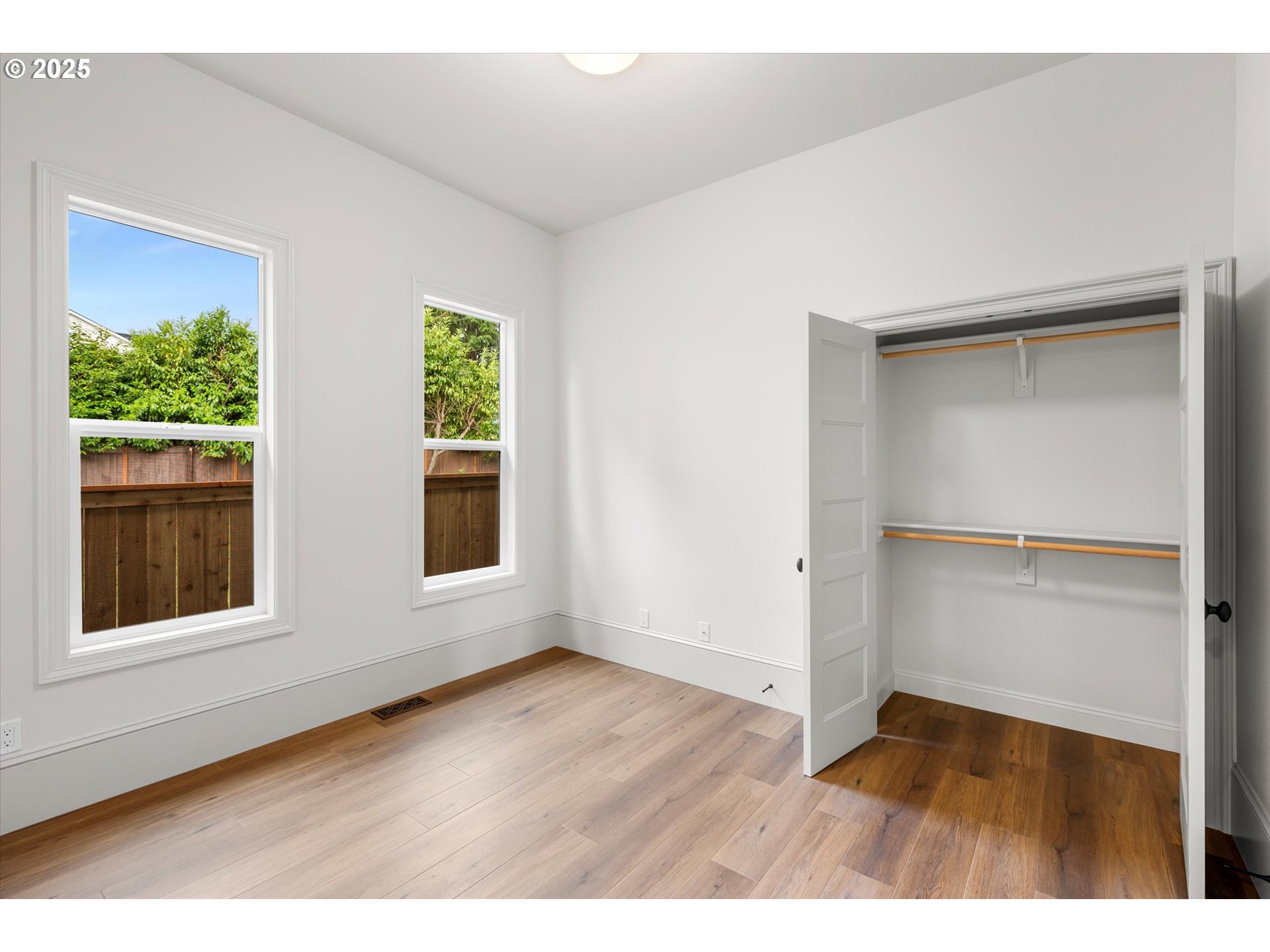 2089 5th Avenue West Linn, OR 97068 - Photo 21 of 34 a view of an empty room with wooden floor and a window