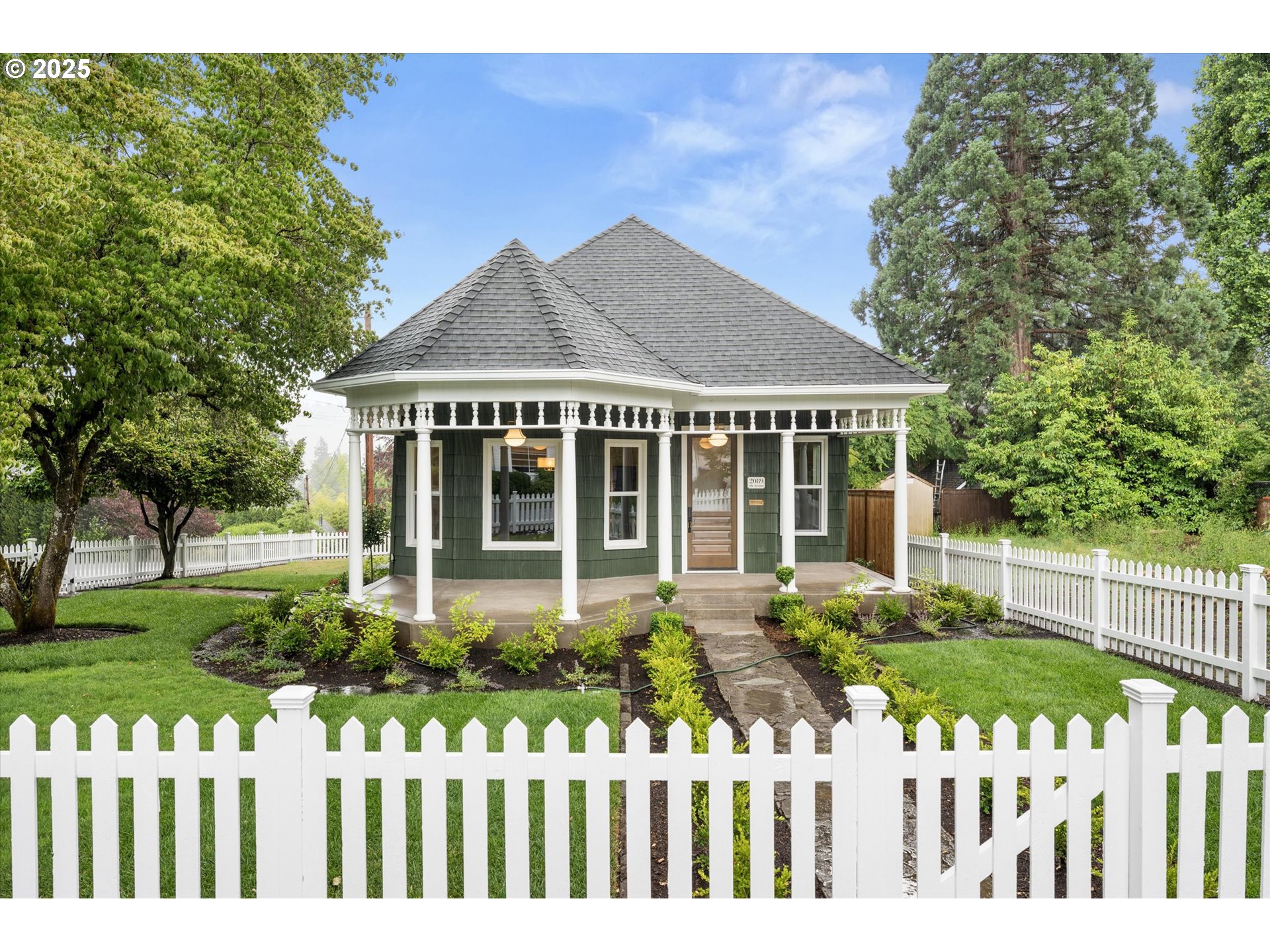 2089 5th Avenue West Linn, OR 97068 - Photo 5 of 34 a front view of a house with a garden