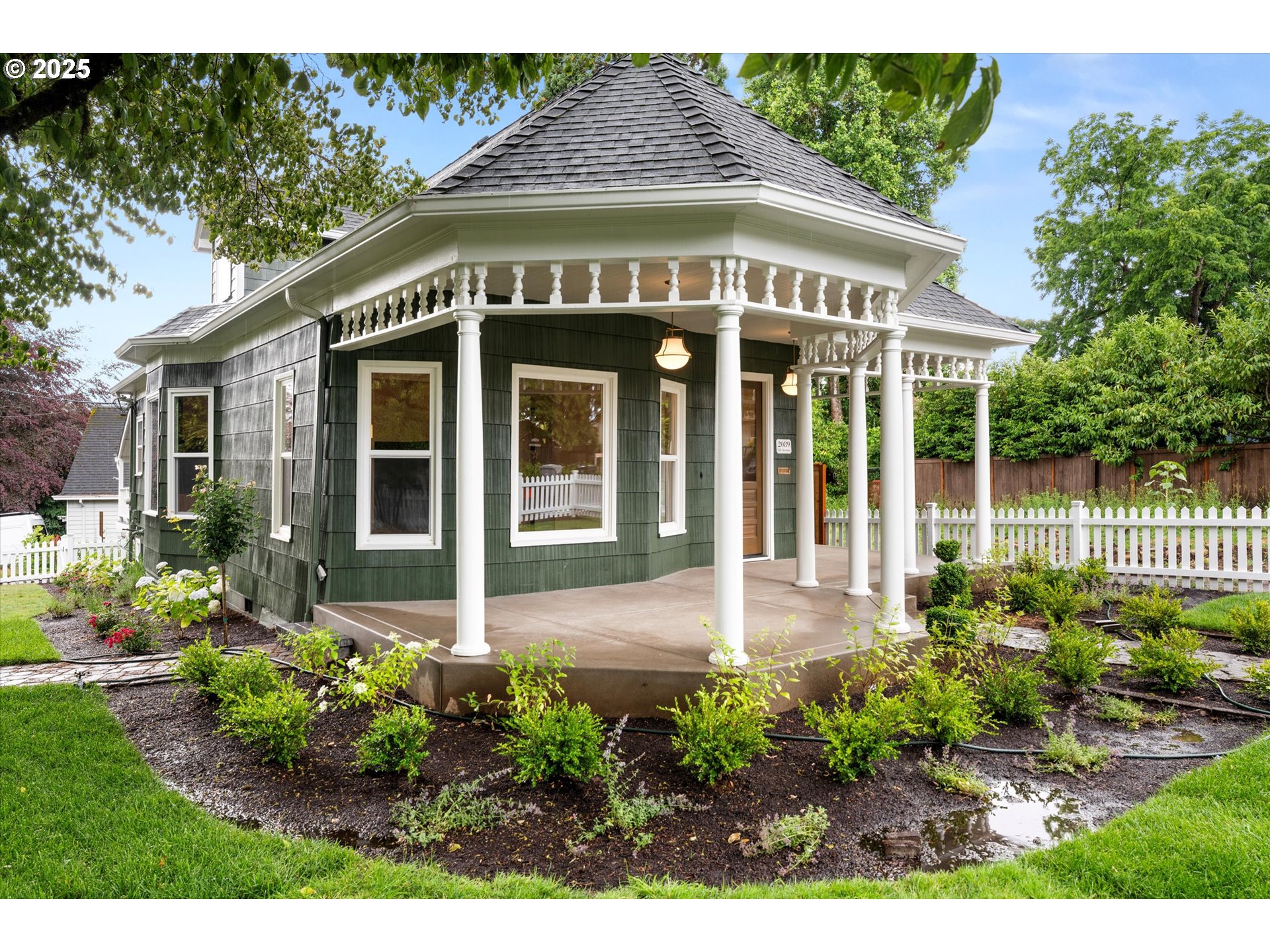 2089 5th Avenue West Linn, OR 97068 - Photo 7 of 34 a front view of a house with a lots of flower garden