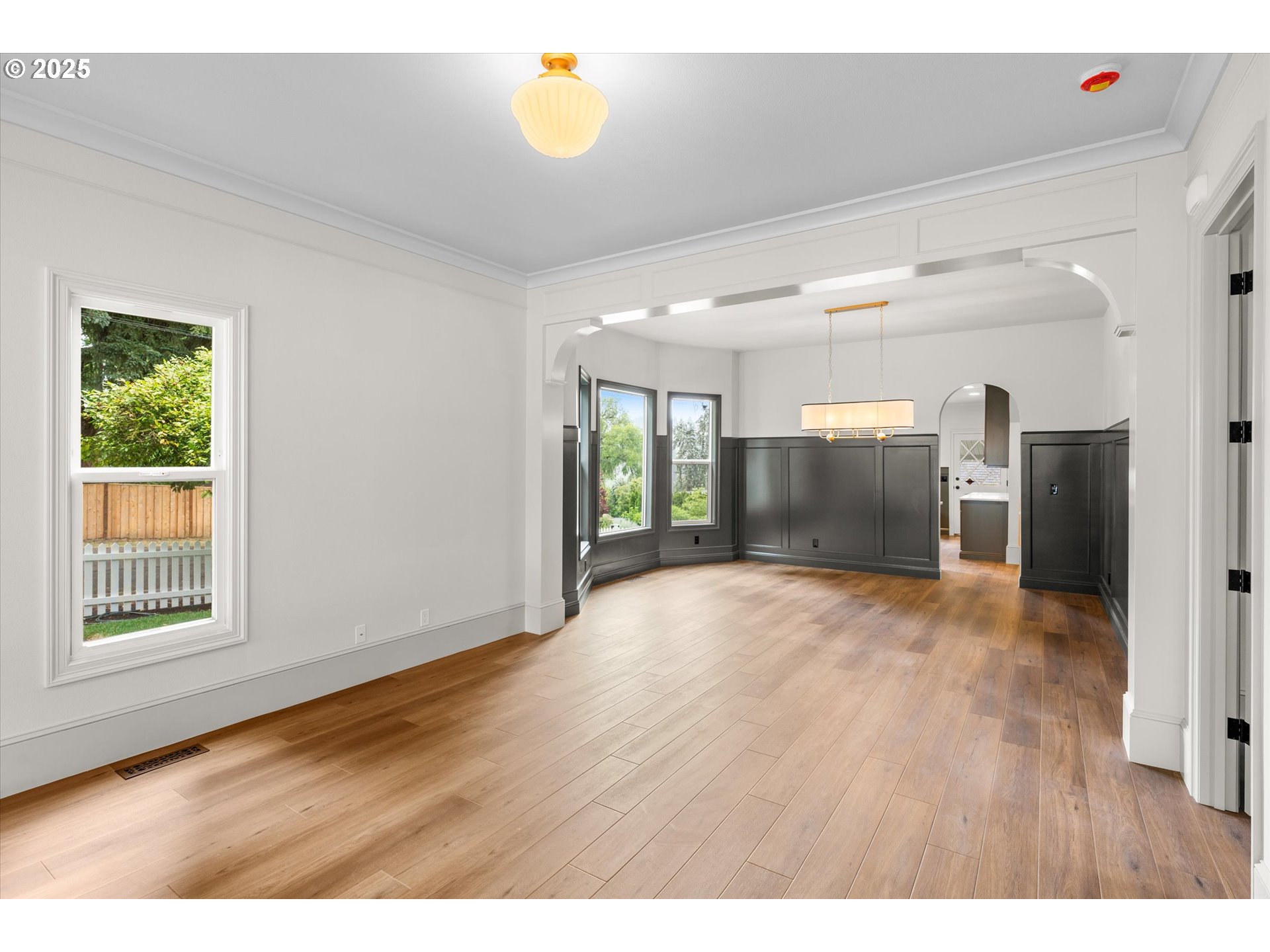 2089 5th Avenue West Linn, OR 97068 - Photo 9 of 34 a view of an empty room with window and wooden floor