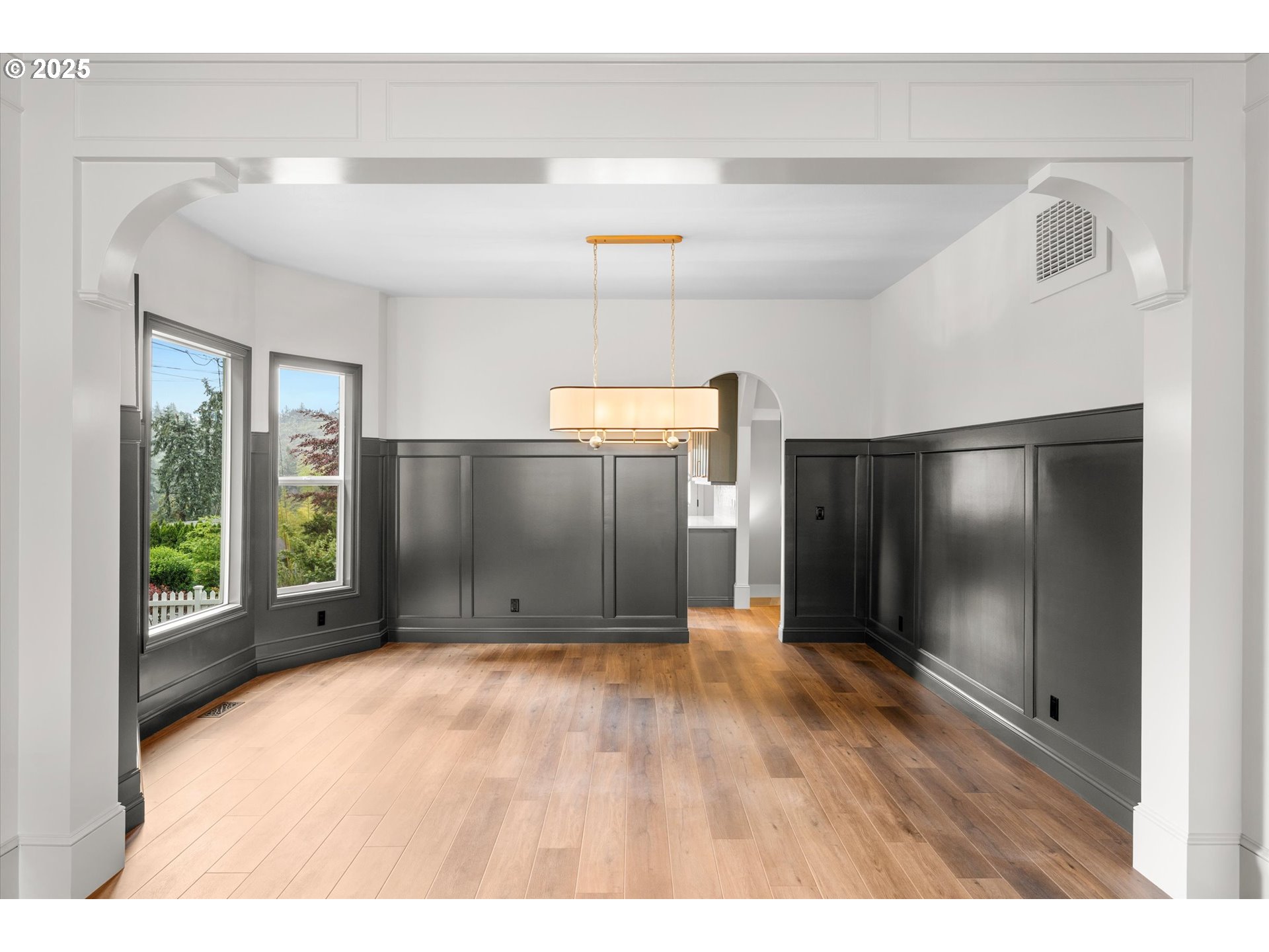 2089 5th Avenue West Linn, OR 97068 - Photo 10 of 34 a view of an empty room with wooden floor and windows