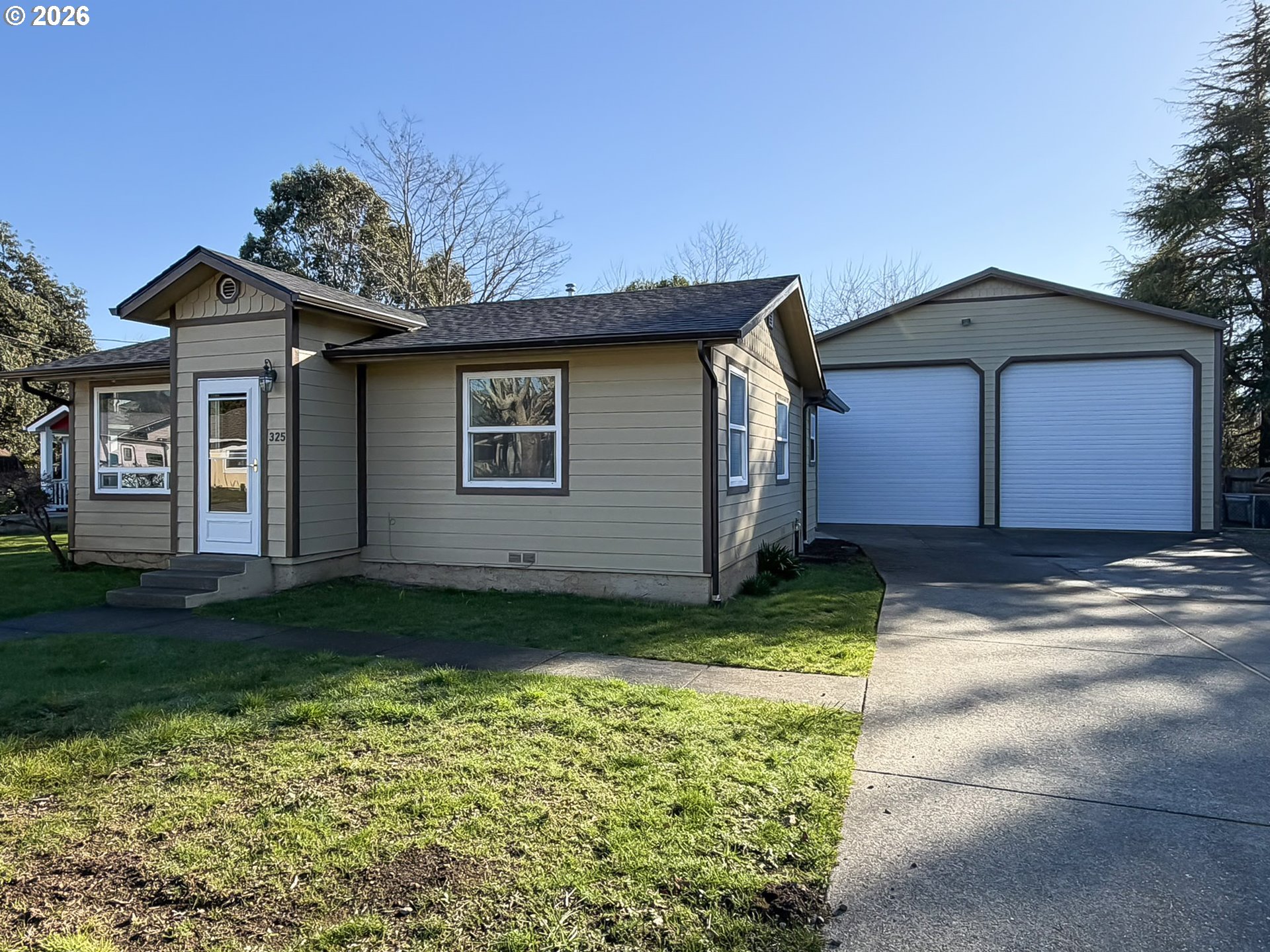 325 Railroad Street Brookings, OR 97415 - Photo 12 of 38 a view of a house with a yard
