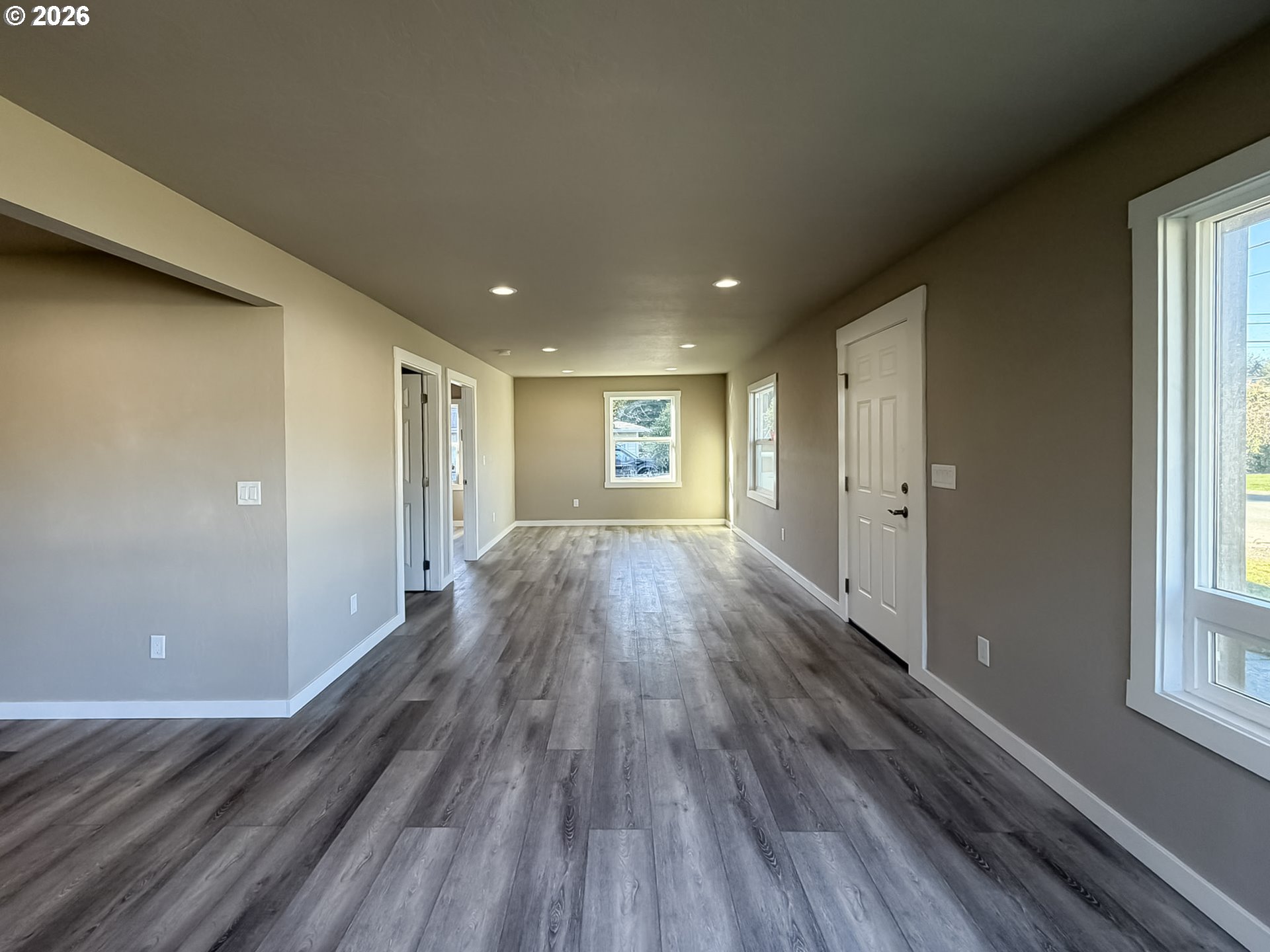 325 Railroad Street Brookings, OR 97415 - Photo 22 of 38 a view of hallway with wooden floor and stairs