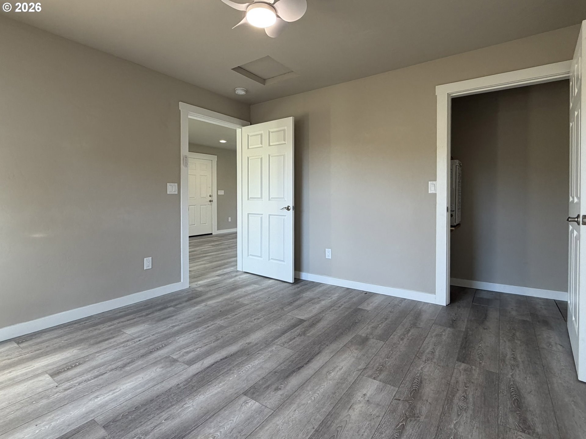 325 Railroad Street Brookings, OR 97415 - Photo 29 of 38 wooden floor in an empty room with a window