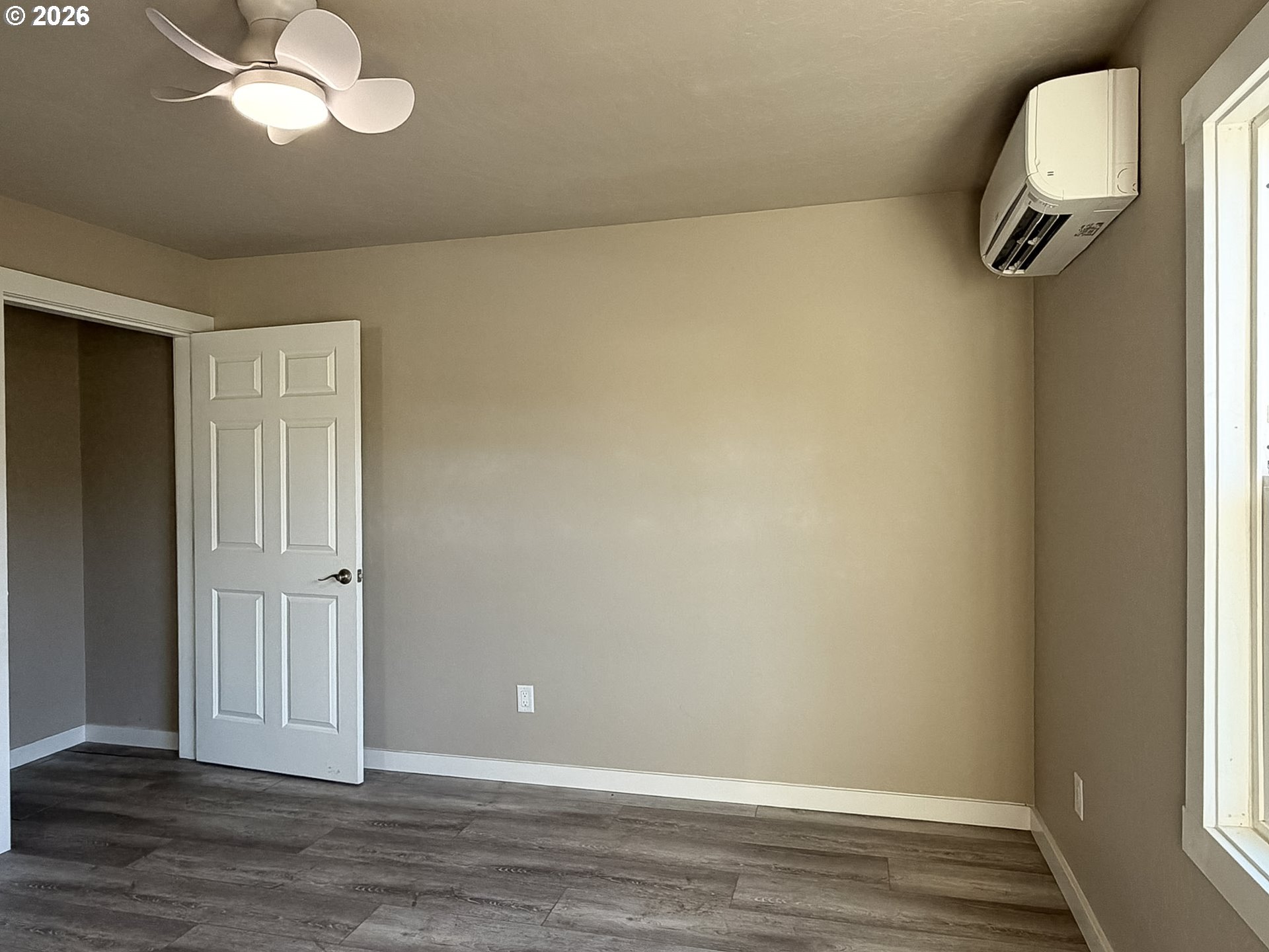 325 Railroad Street Brookings, OR 97415 - Photo 30 of 38 a view of a room with wooden floor and windows
