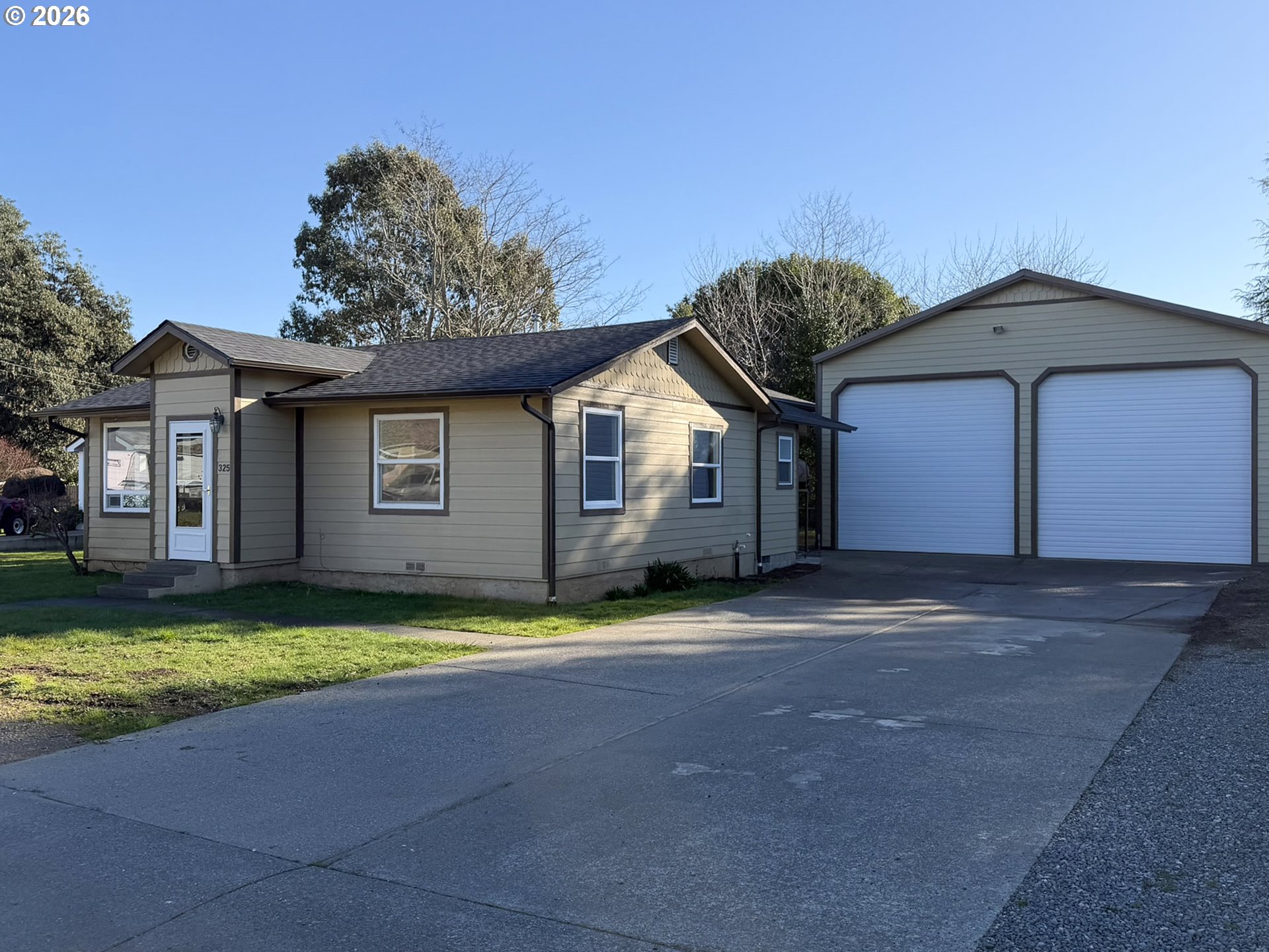 325 Railroad Street Brookings, OR 97415 - Photo 3 of 38 a view of a house with pool and yard