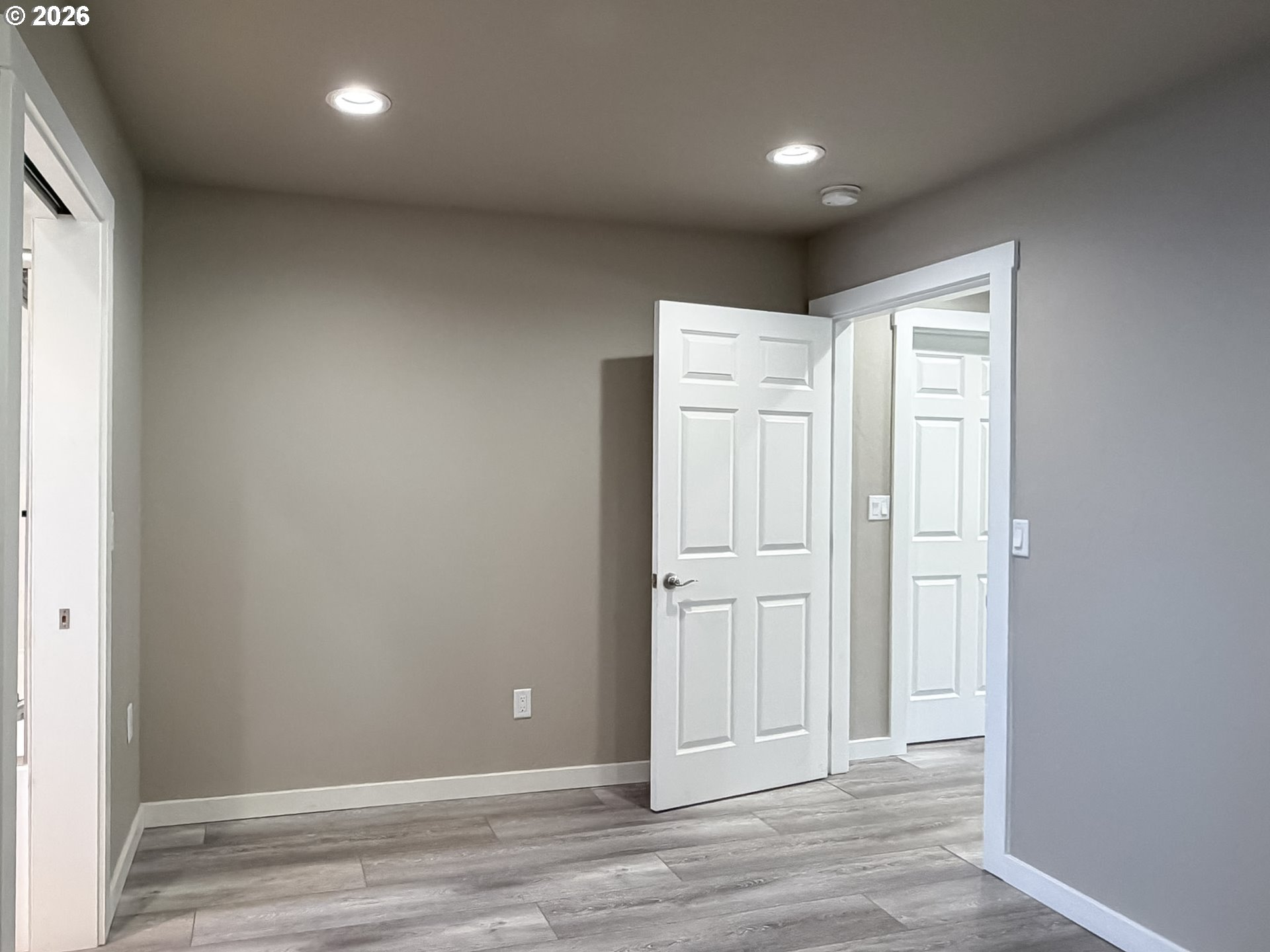 325 Railroad Street Brookings, OR 97415 - Photo 35 of 38 an empty room with wooden floor and closet