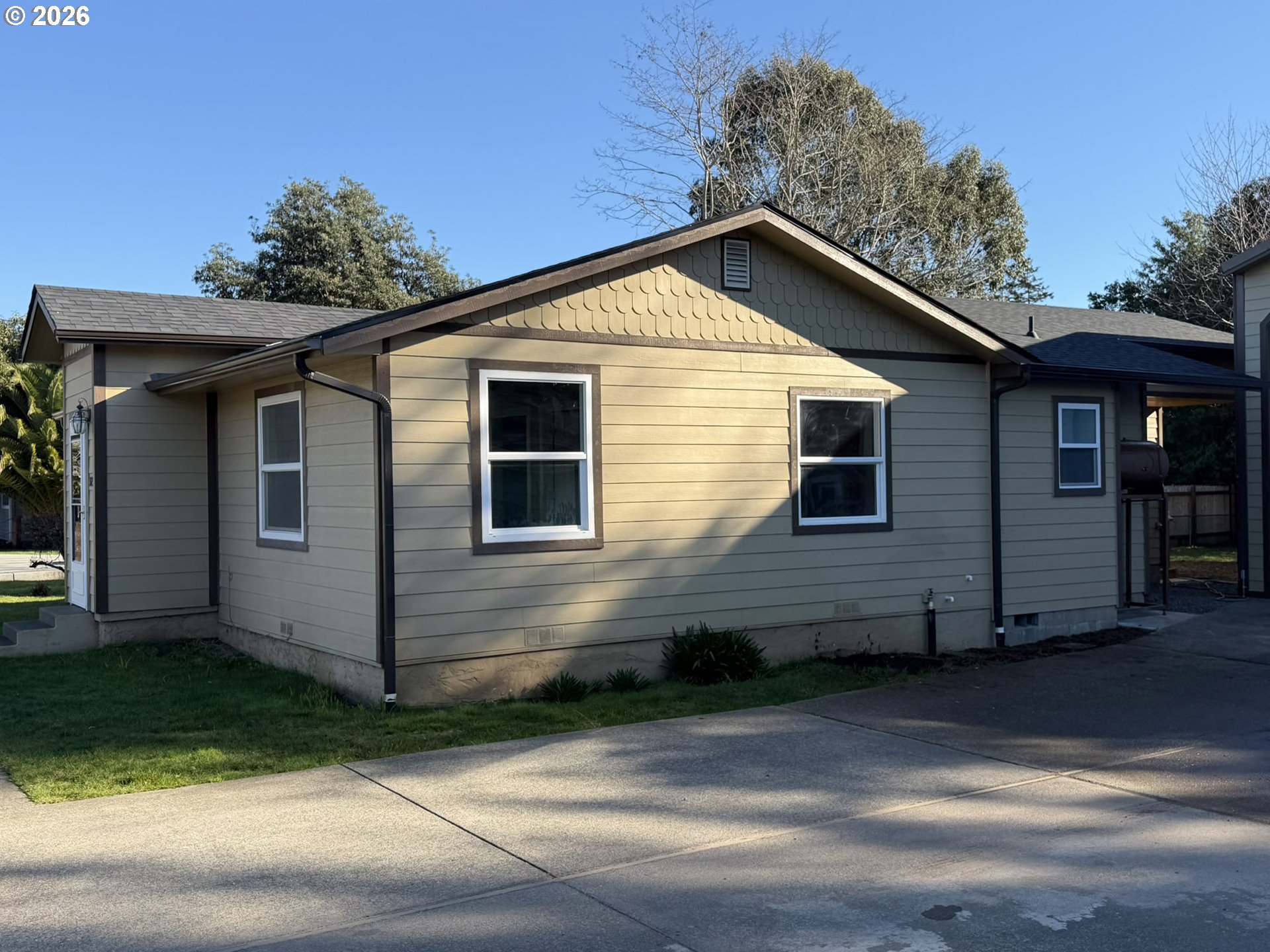 325 Railroad Street Brookings, OR 97415 - Photo 4 of 38 a view of a house with a yard