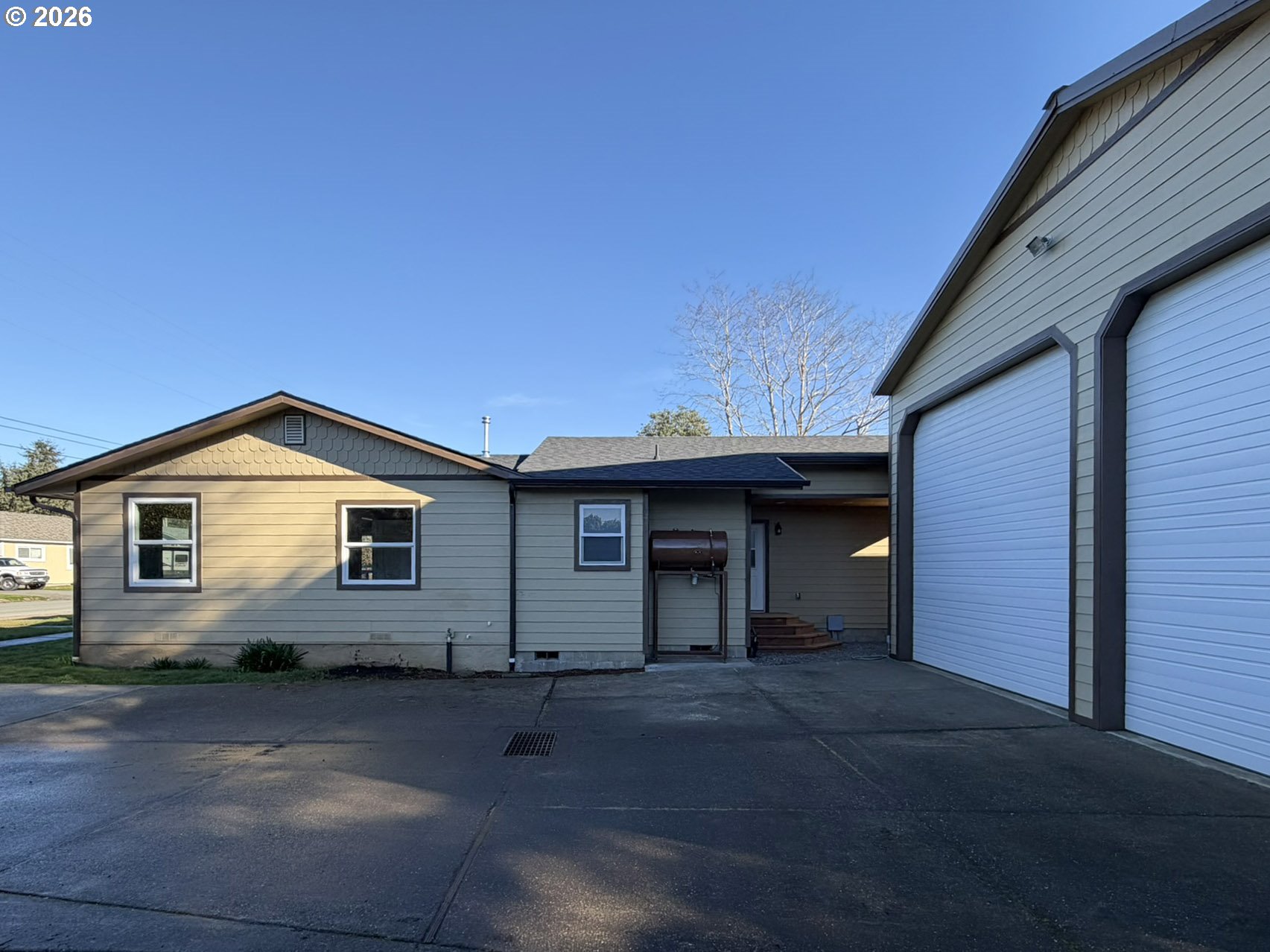 325 Railroad Street Brookings, OR 97415 - Photo 6 of 38 a front view of a house with a yard