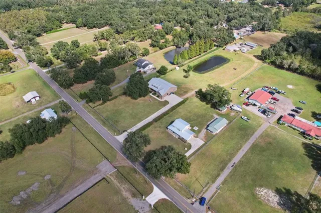 a view of a livingroom with a ceiling fan and window