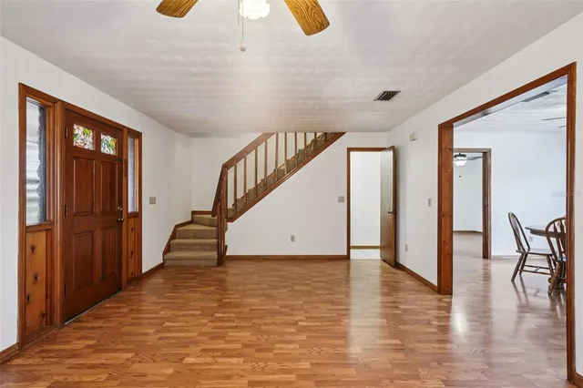 a dining room with furniture and window