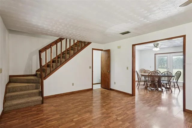 a kitchen with stainless steel appliances a stove a microwave and a refrigerator
