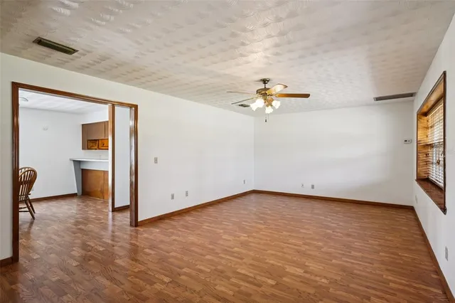 a kitchen with stainless steel appliances granite countertop a sink a stove and refrigerator