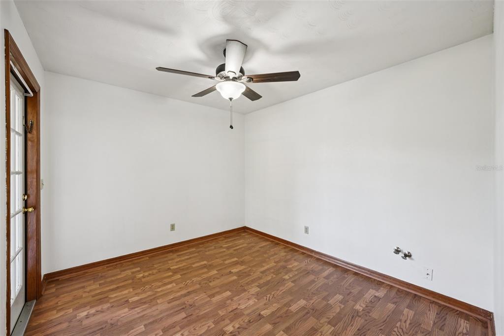 4716 Gallagher Road Plant City, FL 33565 - Photo 31 of 69 an empty room with a window and ceiling fan