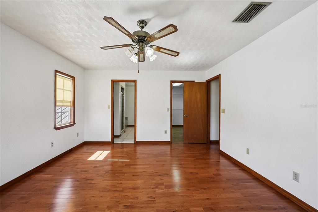 4716 Gallagher Road Plant City, FL 33565 - Photo 33 of 69 wooden floor in an empty room with a window