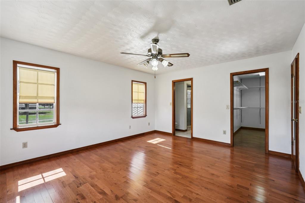 4716 Gallagher Road Plant City, FL 33565 - Photo 34 of 69 a view of an empty room with window and wooden floor