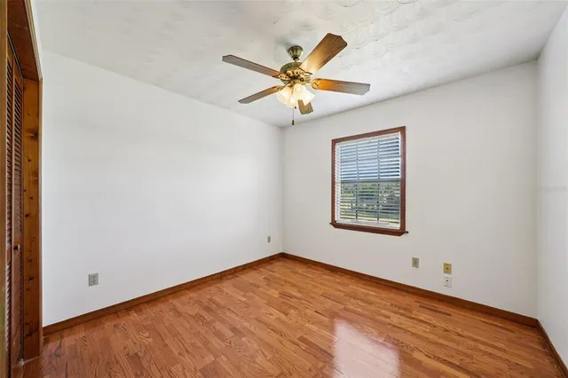 a view of a livingroom with furniture and a kitchen