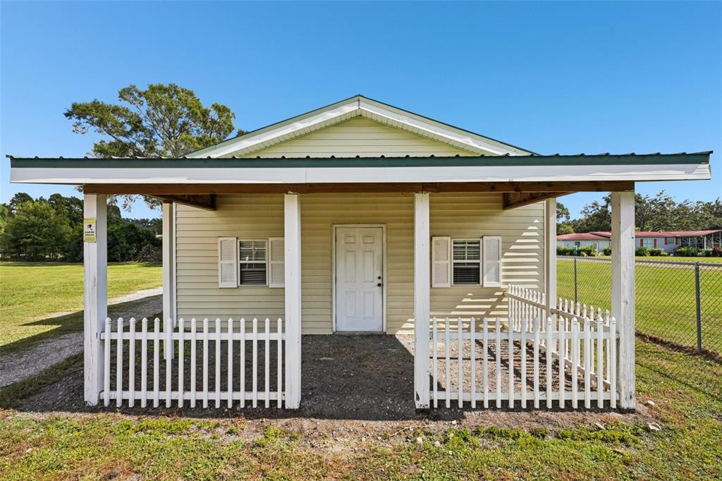 4716 Gallagher Road Plant City, FL 33565 - Photo 56 of 69 a front view of a house with a porch