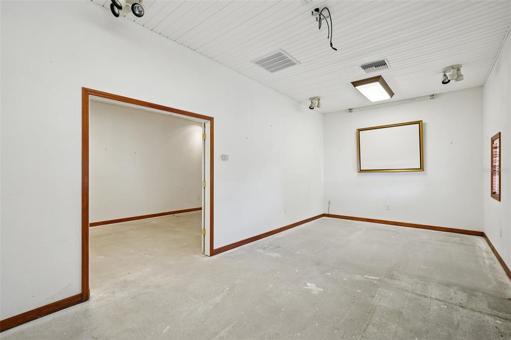 4716 Gallagher Road Plant City, FL 33565 - Photo 61 of 69 an empty room with windows and cabinet