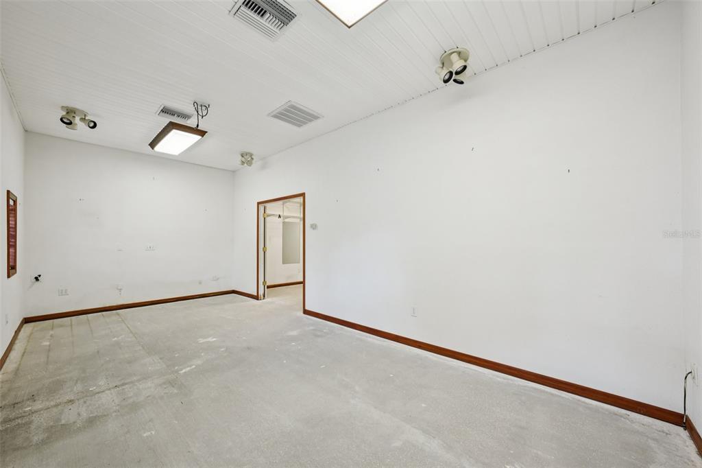 4716 Gallagher Road Plant City, FL 33565 - Photo 64 of 69 an empty room with a window and ceiling fan