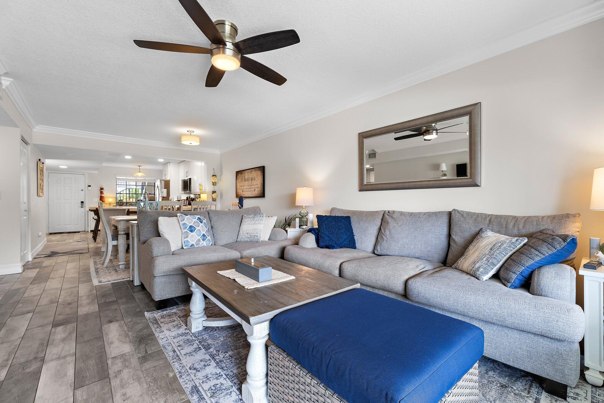 1201 Pinecrest Circle, Unit B Jupiter, FL 33458 - Photo 14 of 39 a living room with furniture kitchen view and a table