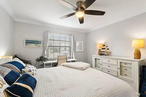 a bedroom with a bed and a dresser