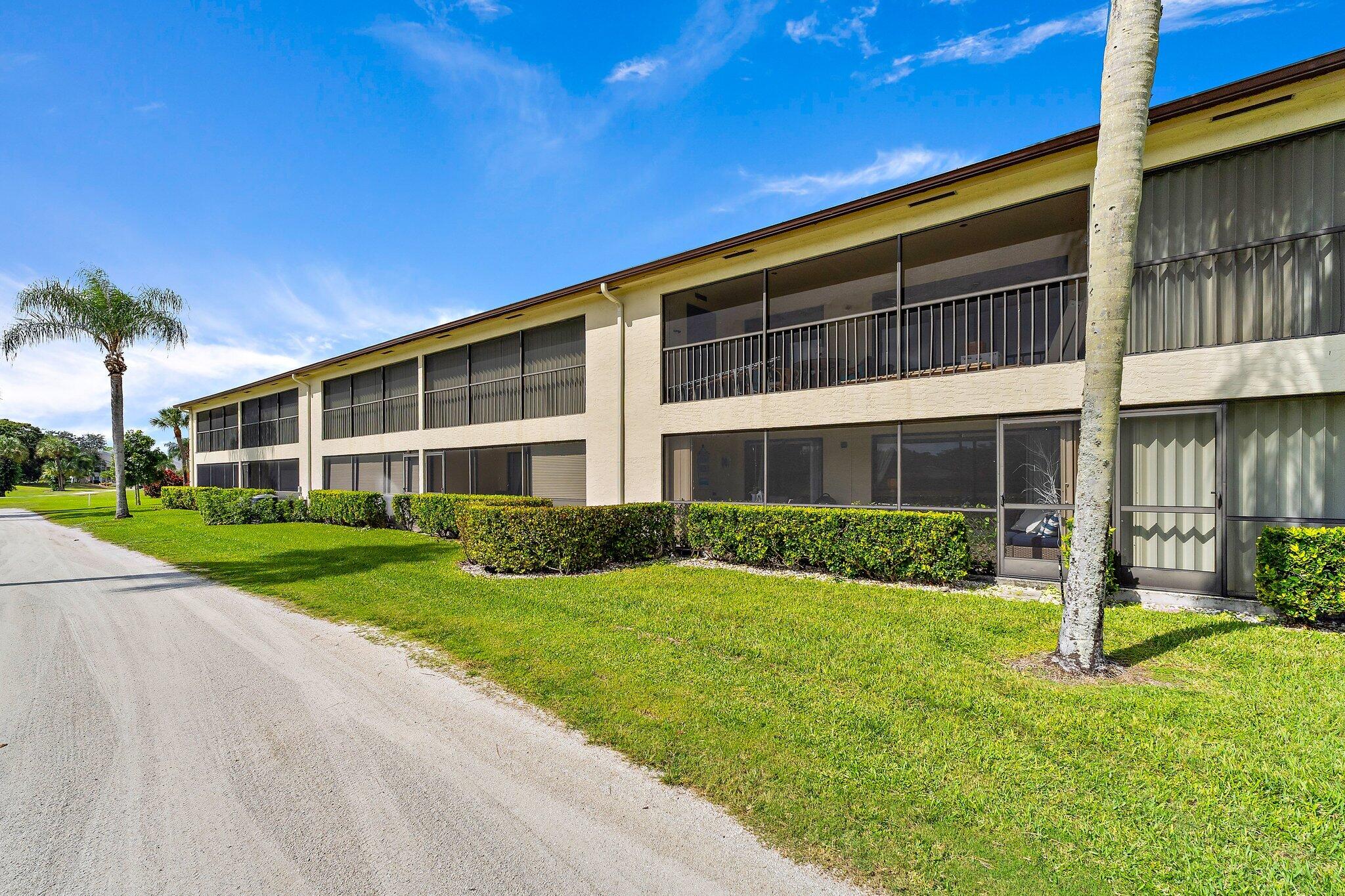 1201 Pinecrest Circle, Unit B Jupiter, FL 33458 - Photo 37 of 39 a view of a house with a yard