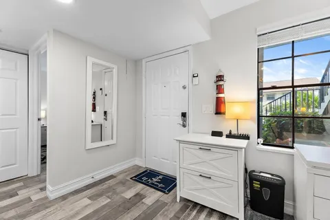 a room with a window and a sink