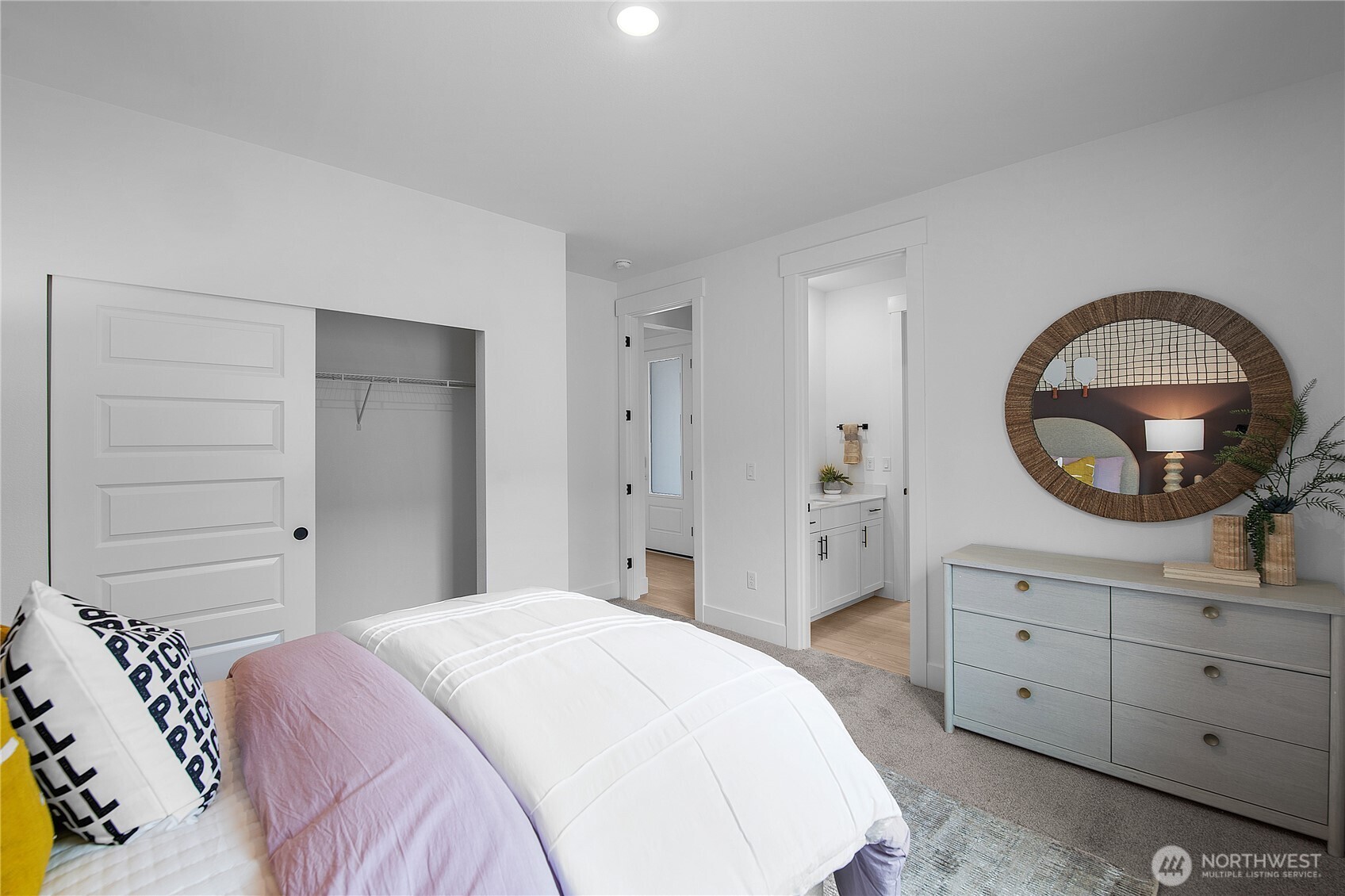 601 Sunbeam Place Sequim, WA 98382 - Photo 21 of 26 a bedroom with a bed and a dresser