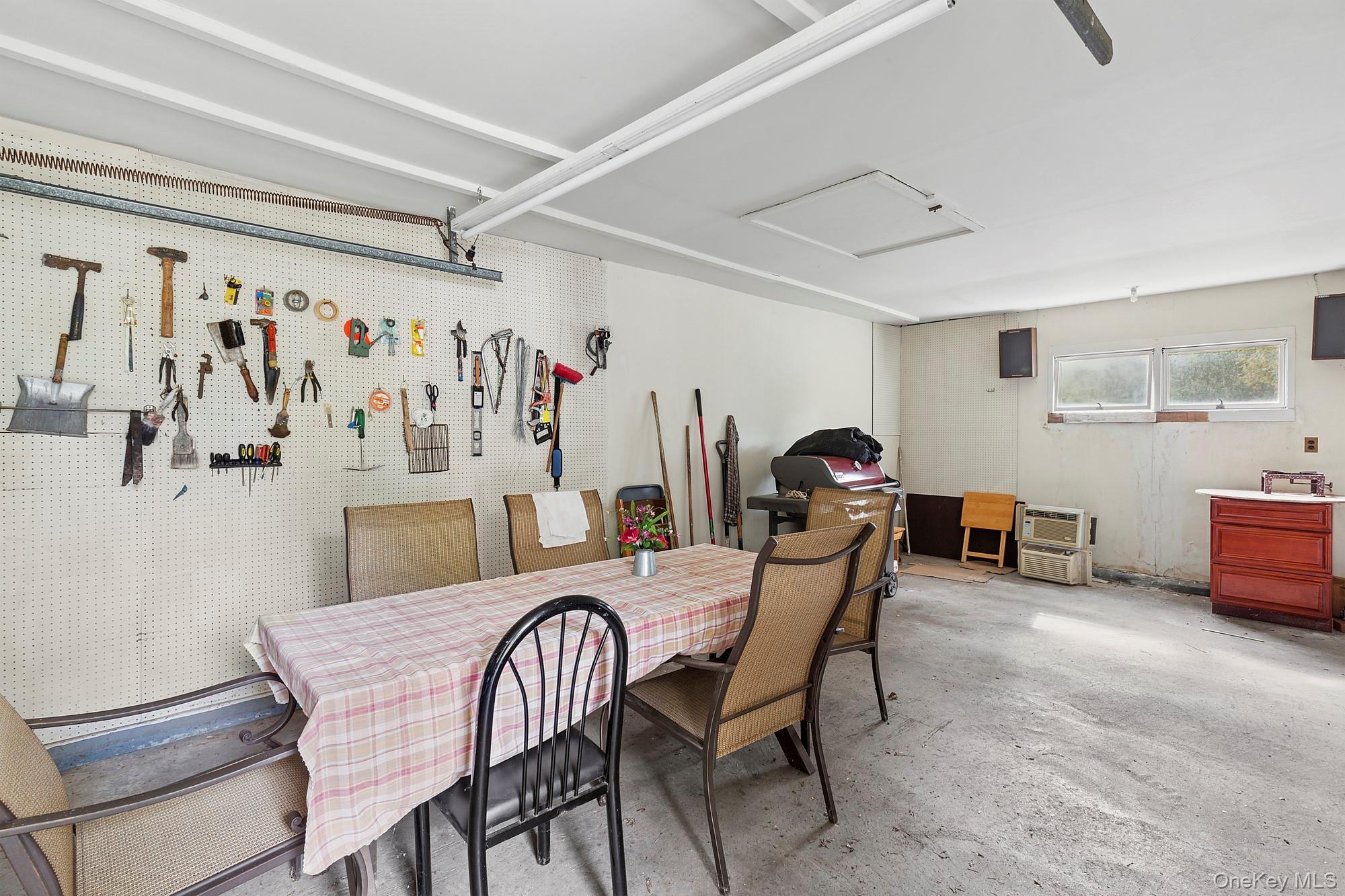 1645 Ruth Road Mattituck, NY 11952 - Photo 15 of 16 a dining room with furniture and a window