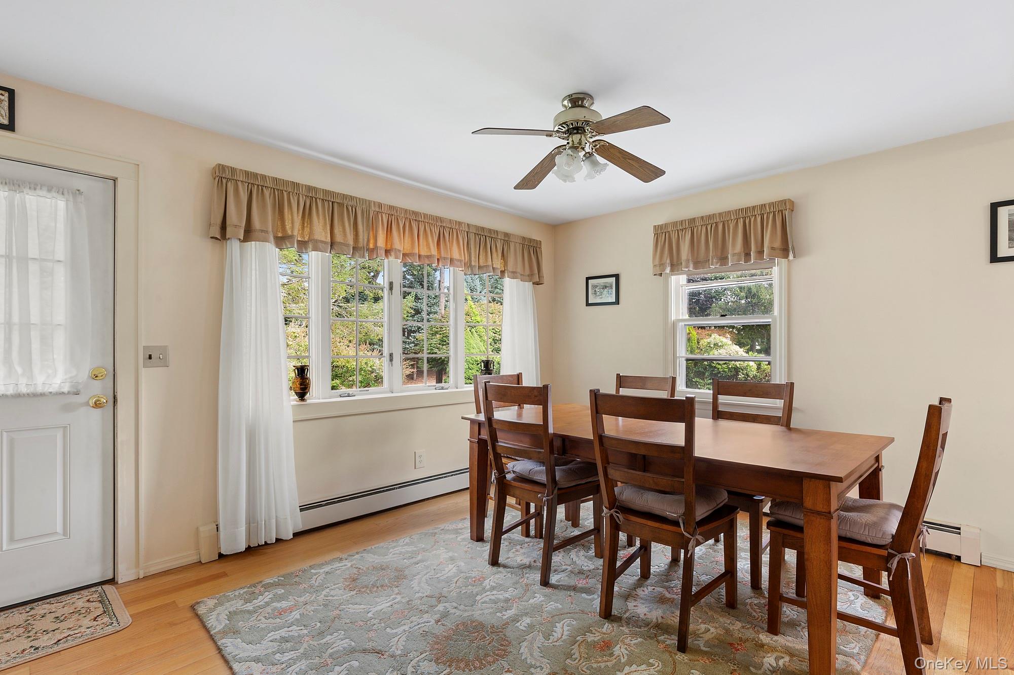 1645 Ruth Road Mattituck, NY 11952 - Photo 4 of 16 a view of a dining room with furniture window and wooden floor