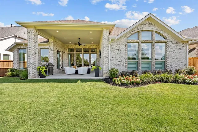 a view of a house with a swimming pool and garden