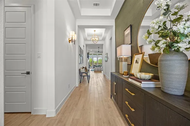 a room with wooden floor and furniture