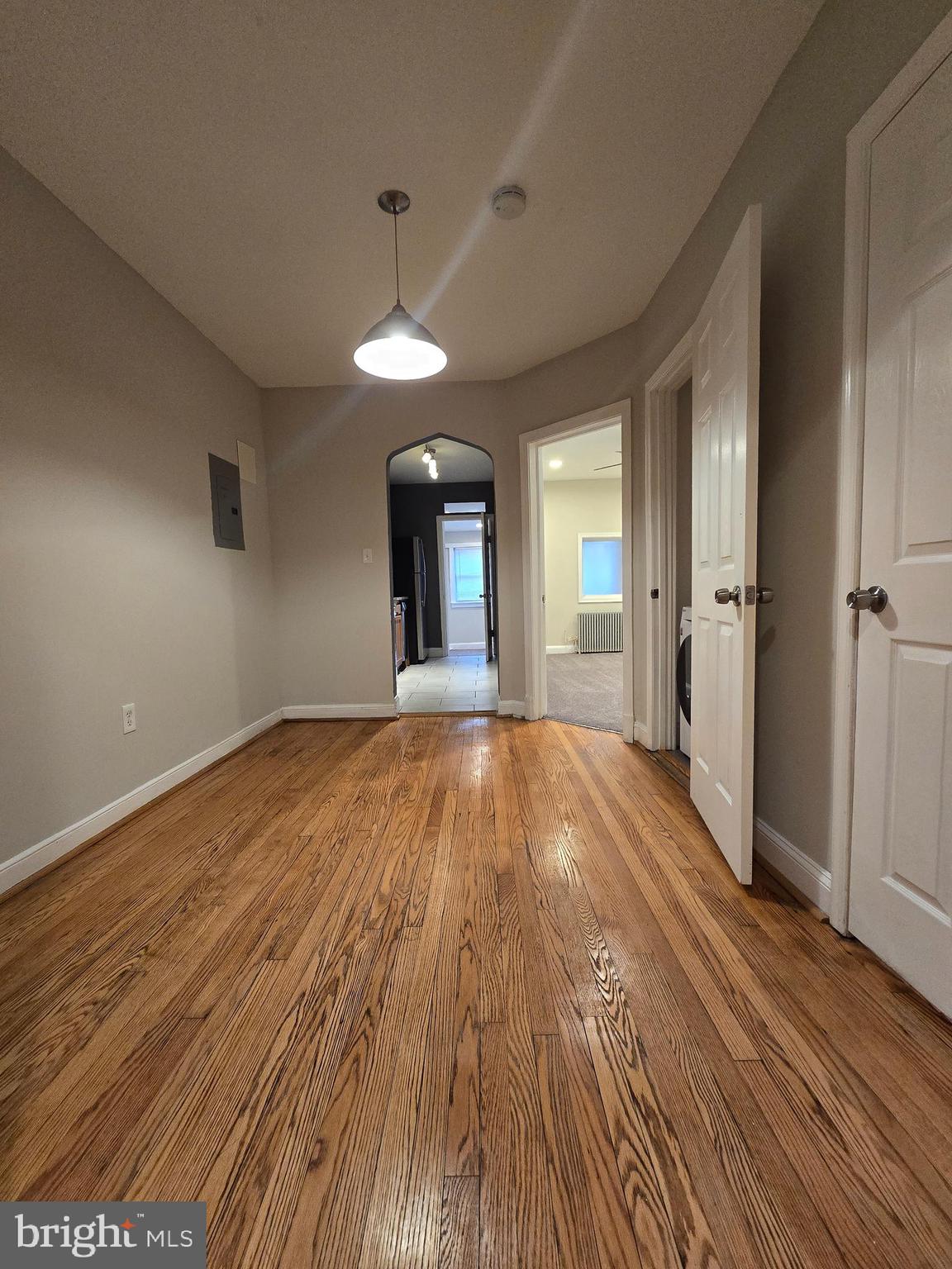 4044 7th Street Northeast, Unit 2 Washington, DC 20017 - Photo 7 of 8 wooden floor in an empty room with a window