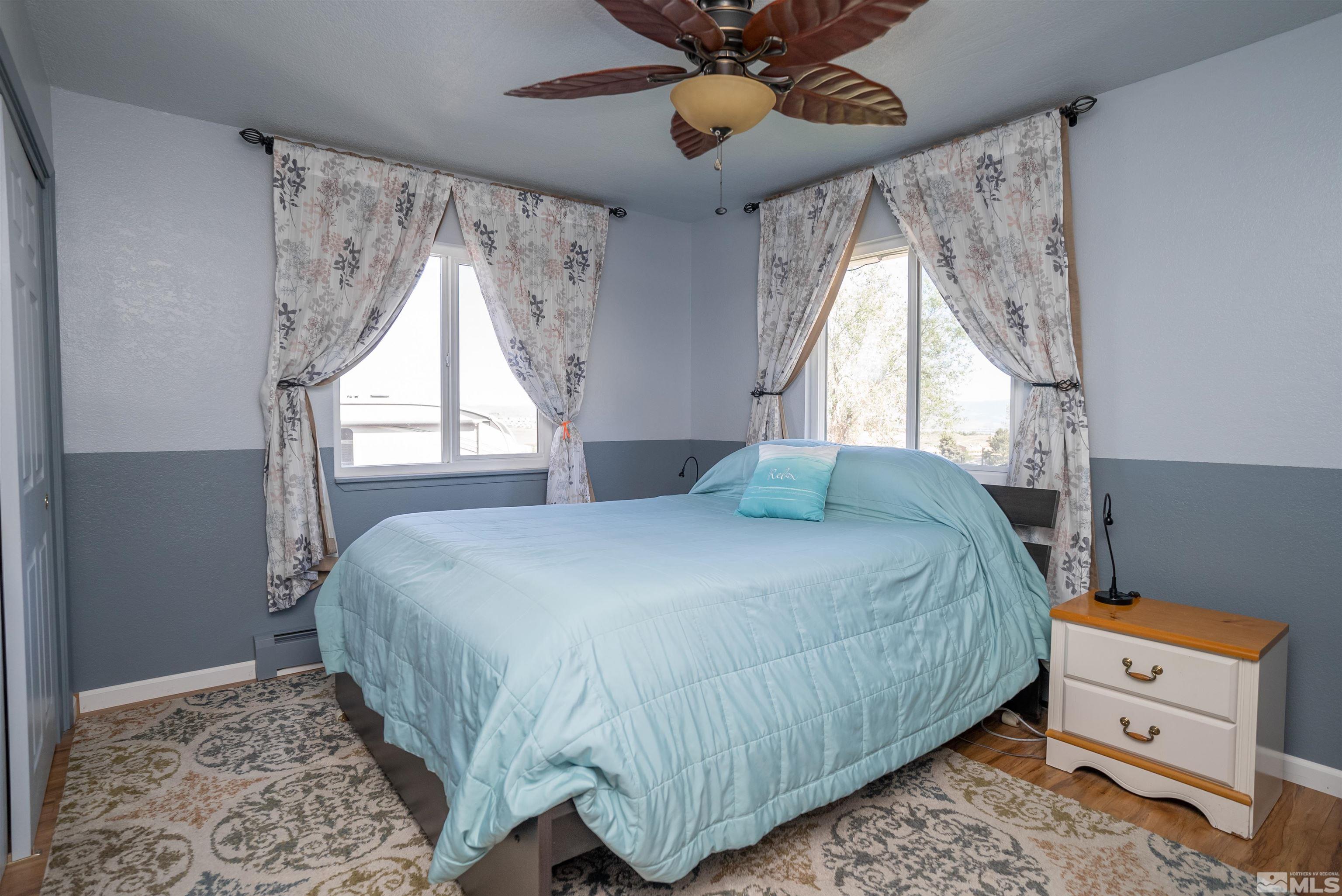4936 Koenig Road Reno, NV 89506 - Photo 12 of 30 a bedroom with a bed and a window