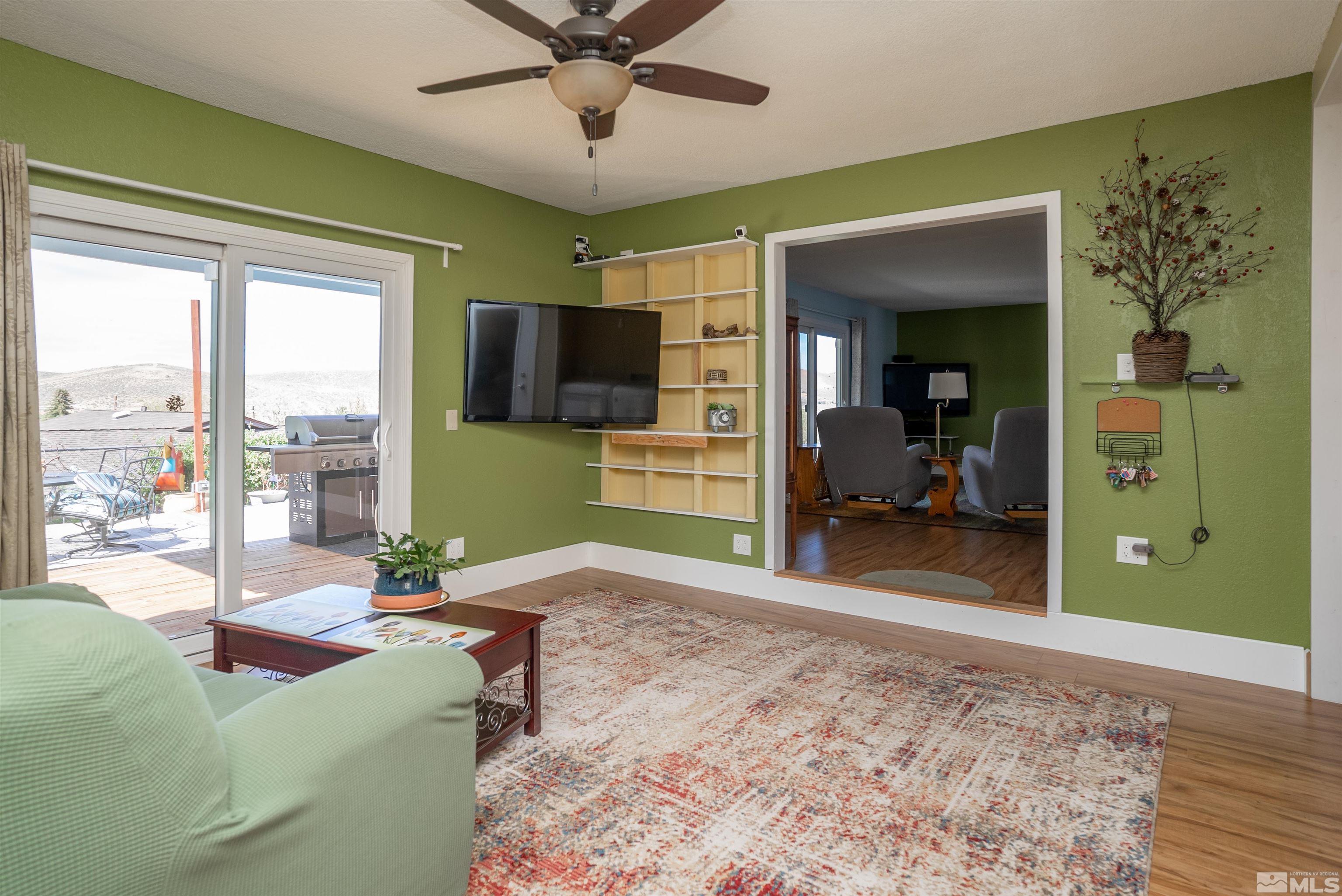 4936 Koenig Road Reno, NV 89506 - Photo 16 of 30 a living room with furniture and a large window