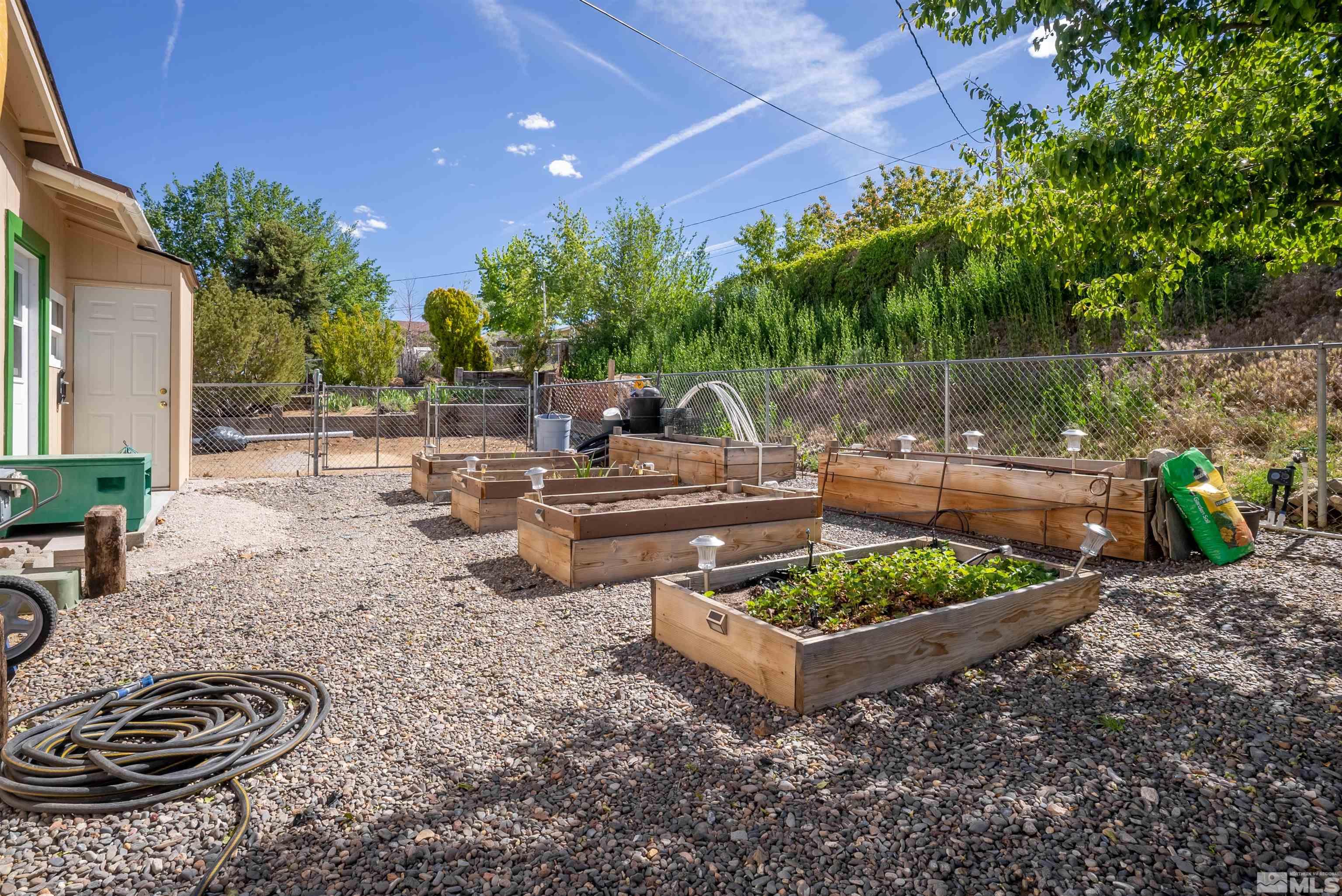 4936 Koenig Road Reno, NV 89506 - Photo 18 of 30 a view of a backyard with plants and a patio