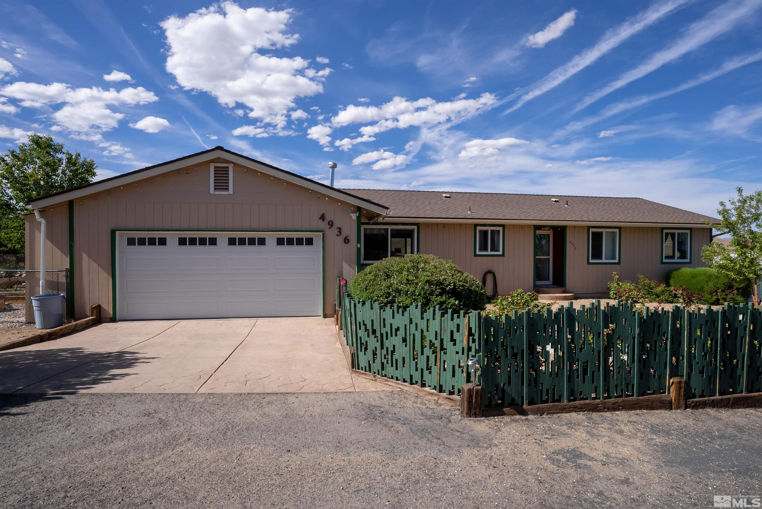 4936 Koenig Road Reno, NV 89506 - Photo 2 of 30 a front view of house with a garden