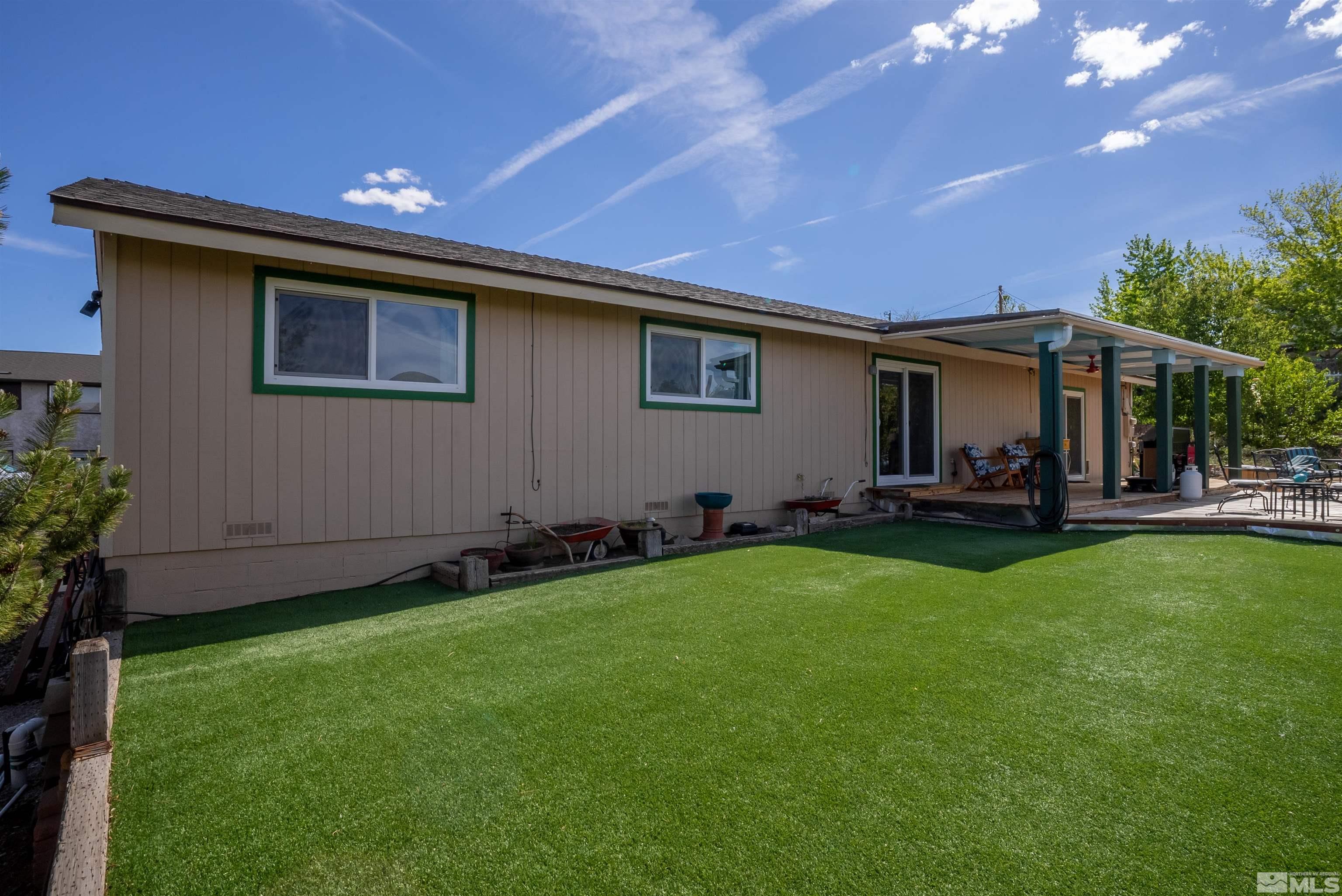 4936 Koenig Road Reno, NV 89506 - Photo 22 of 30 a backyard of a house with table and chairs