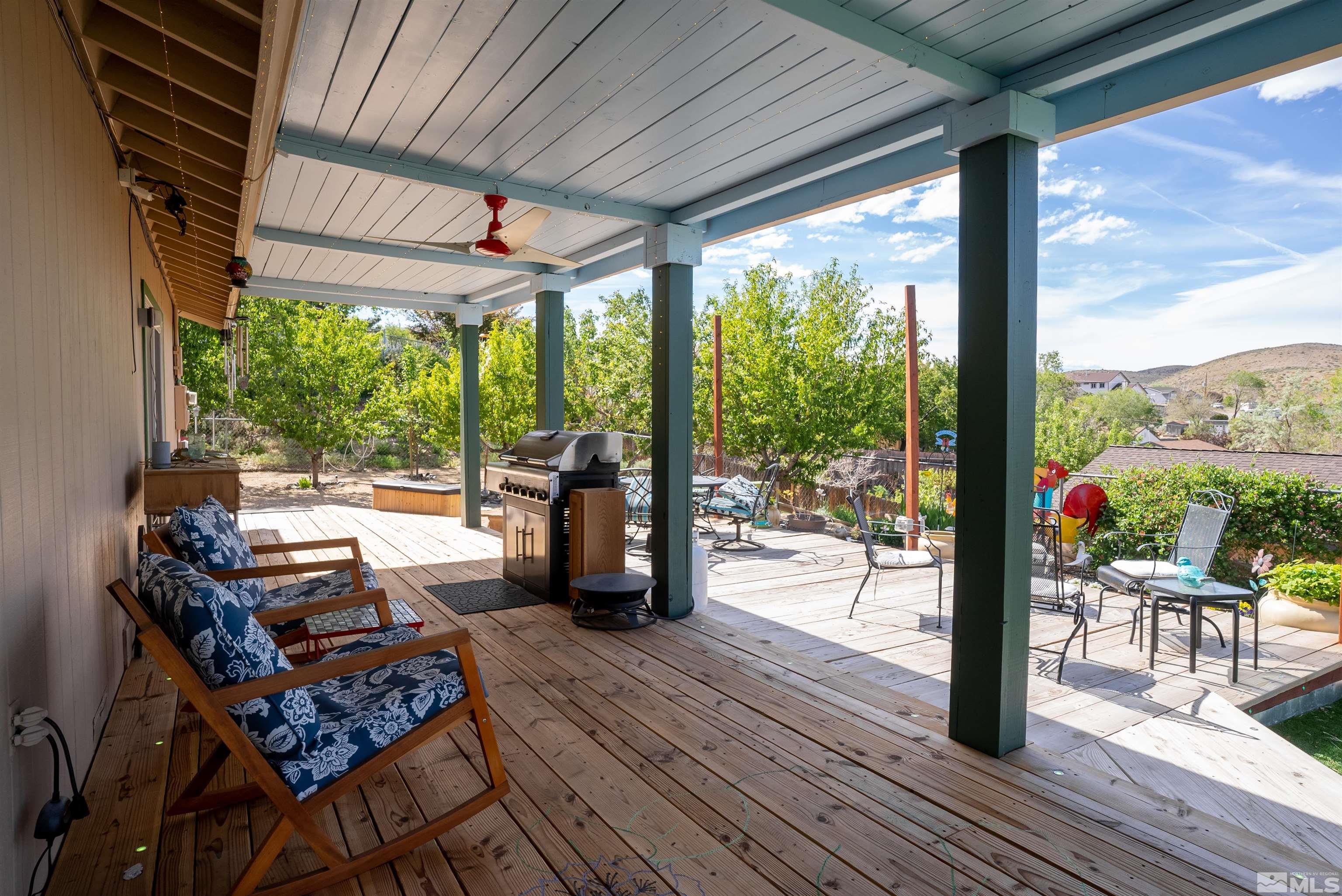 4936 Koenig Road Reno, NV 89506 - Photo 24 of 30 a view of a patio with chairs and wooden floor