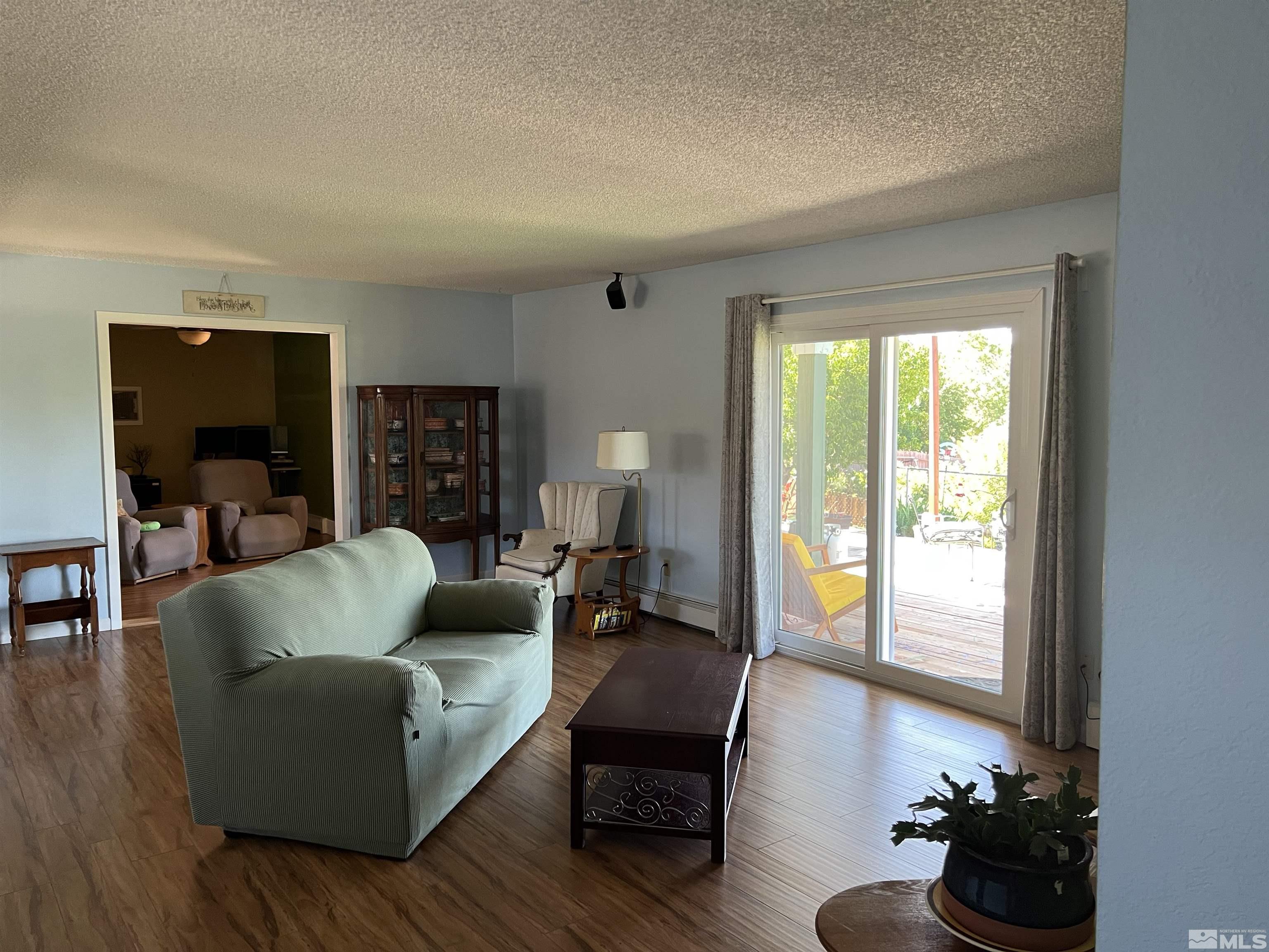 4936 Koenig Road Reno, NV 89506 - Photo 3 of 30 a living room with furniture and a large window