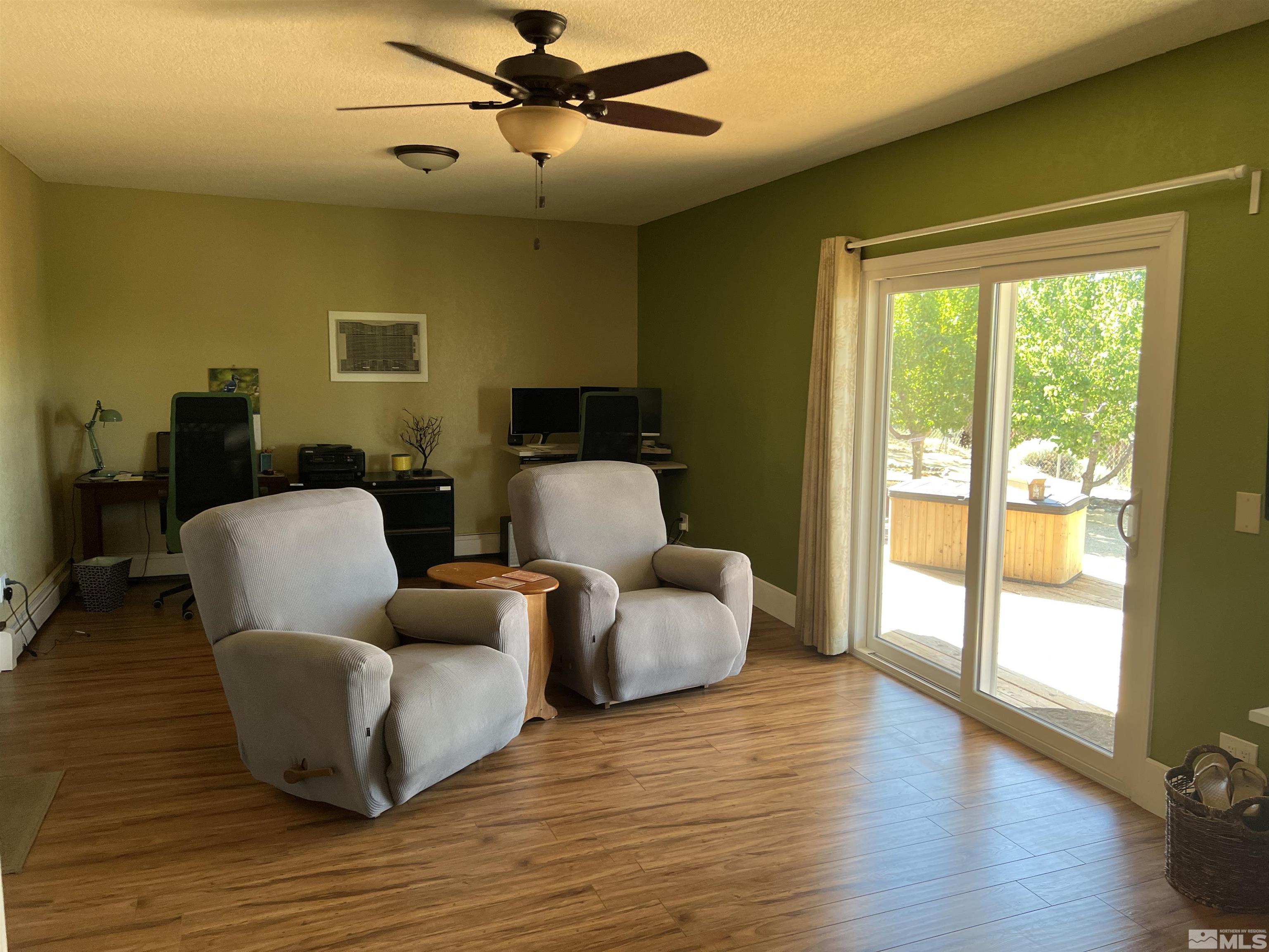 4936 Koenig Road Reno, NV 89506 - Photo 5 of 30 a living room with furniture and a large window