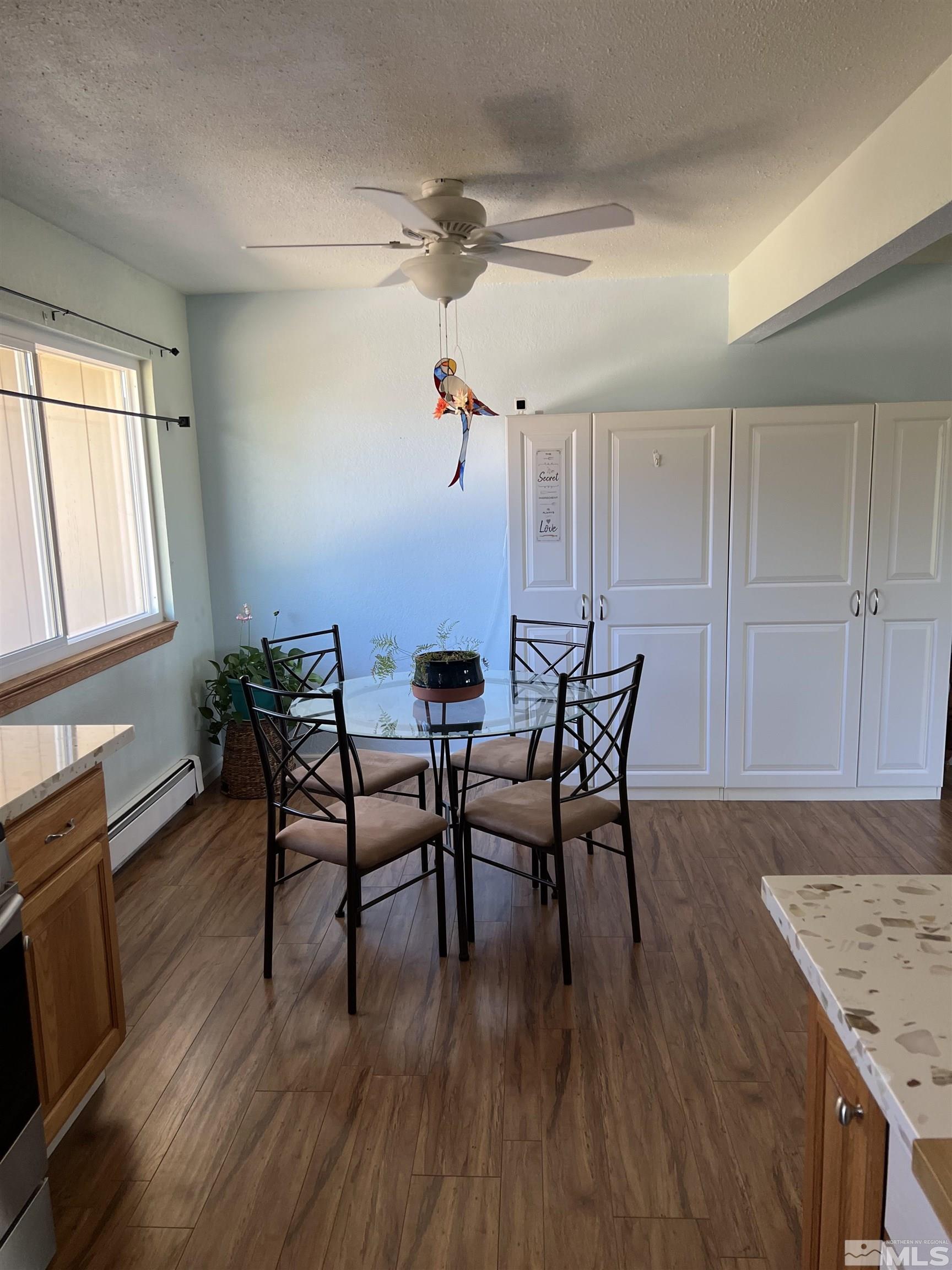 4936 Koenig Road Reno, NV 89506 - Photo 9 of 30 a view of a dining room with furniture and wooden floor