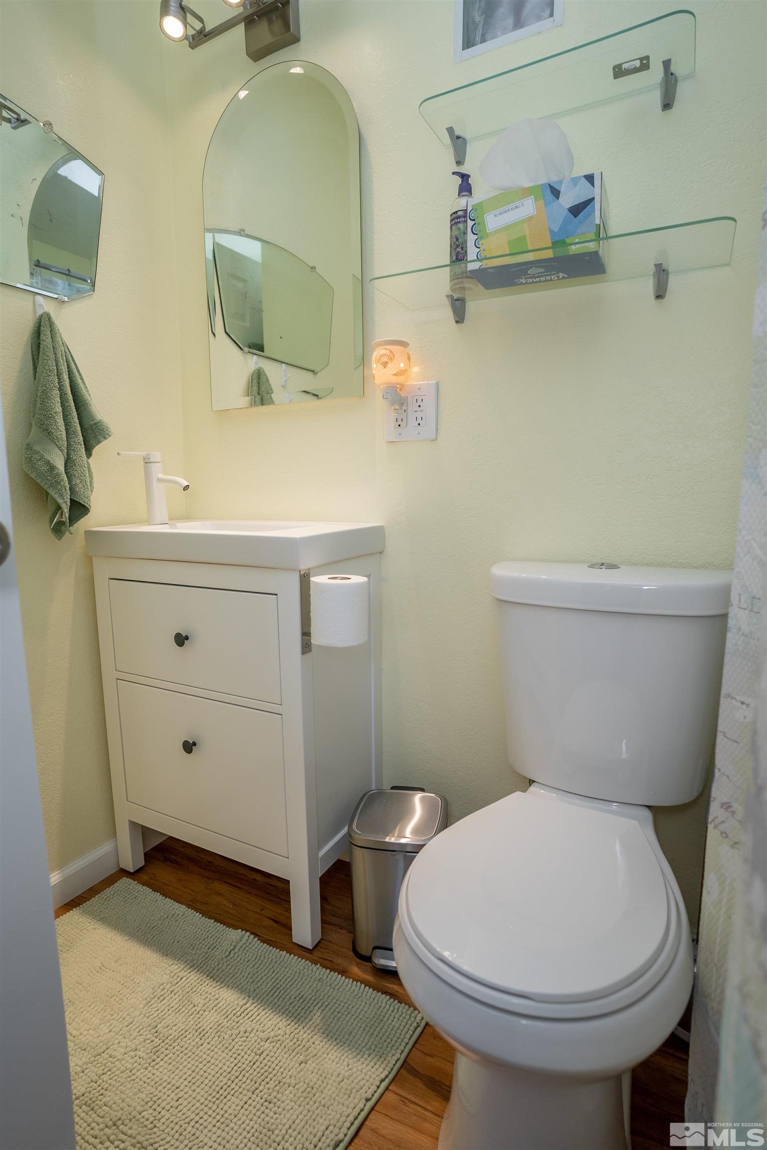4936 Koenig Road Reno, NV 89506 - Photo 10 of 30 a bathroom with a toilet sink and mirror